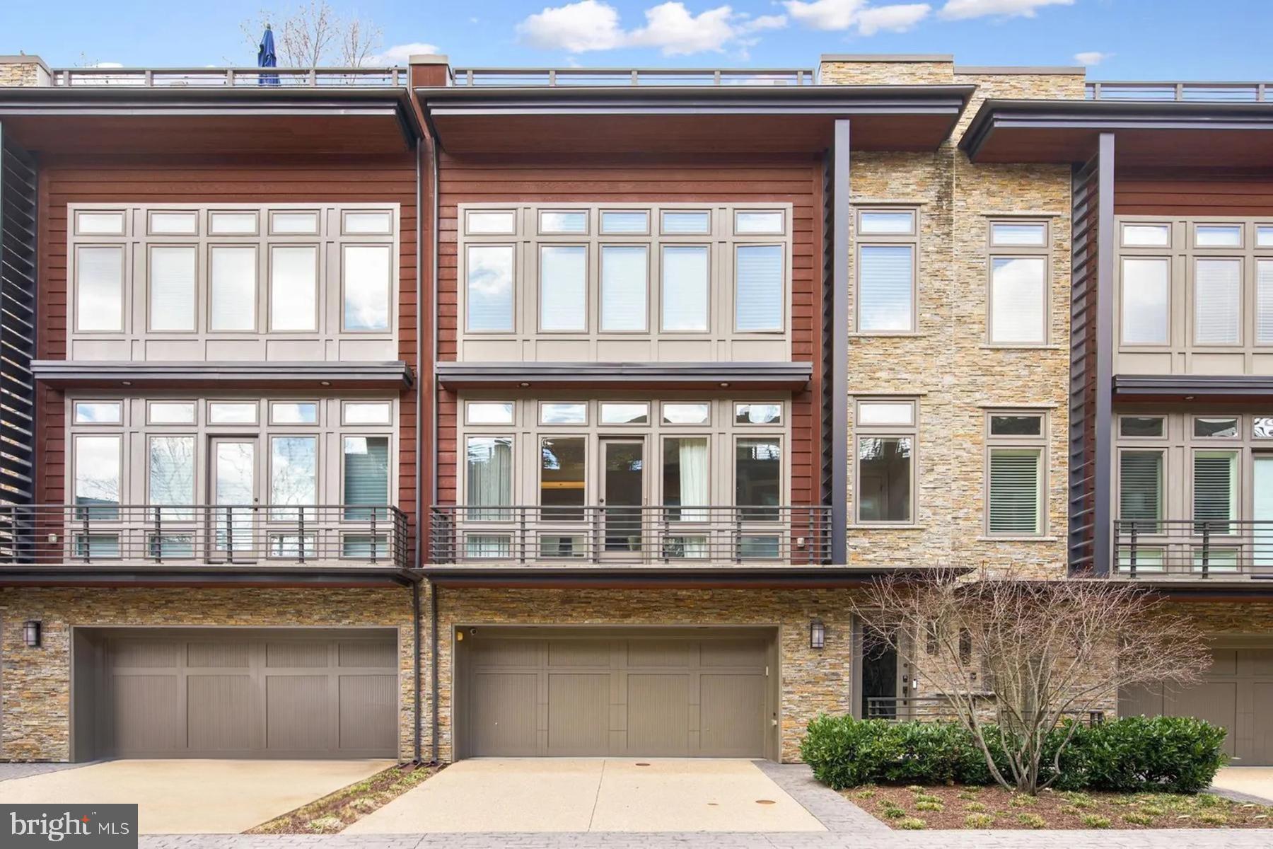 Welcome home!  This luxurious elevator townhome is located in the highly sought-after Little Falls Place community, offering direct access to the Capital Crescent Trail. The townhome was built in 2013 and boasts the largest floor plan available in the community, with a total of 2,644 square feet of interior living space.

The interior of the home is designed to be spacious and open, with an emphasis on entertaining and comfortable family living. The floor plan includes a large kitchen and family room, a formal dining room, a home office, four bedrooms, three full bathrooms, and one half bathroom. The recreation room, laundry room, and two-car garage are additional features that provide extra space, convenience and ease of living.

One of the standout features of this townhome is its private rooftop patio, which overlooks the Capital Crescent Trail and offers breathtaking views of the surrounding area. The rooftop terrace includes an outdoor kitchen, a retractable awning, a TV, and a gas fireplace, making it the perfect place to relax and entertain guests.

Other highlights of the home include countless floor-to-ceiling windows that allow natural light to flood every room and an elevator that provides easy access to all levels, including the roof terrace and garage level.  Additionally, 9-foot ceilings, a gourmet kitchen, spa baths, numerous walk-in closets, and two gas fireplaces accent this refined home.

Located just a short walk away from downtown Bethesda and Washington DC, this luxurious townhome offers the perfect blend of convenience and upscale living in one of the most desirable neighborhoods in the area.