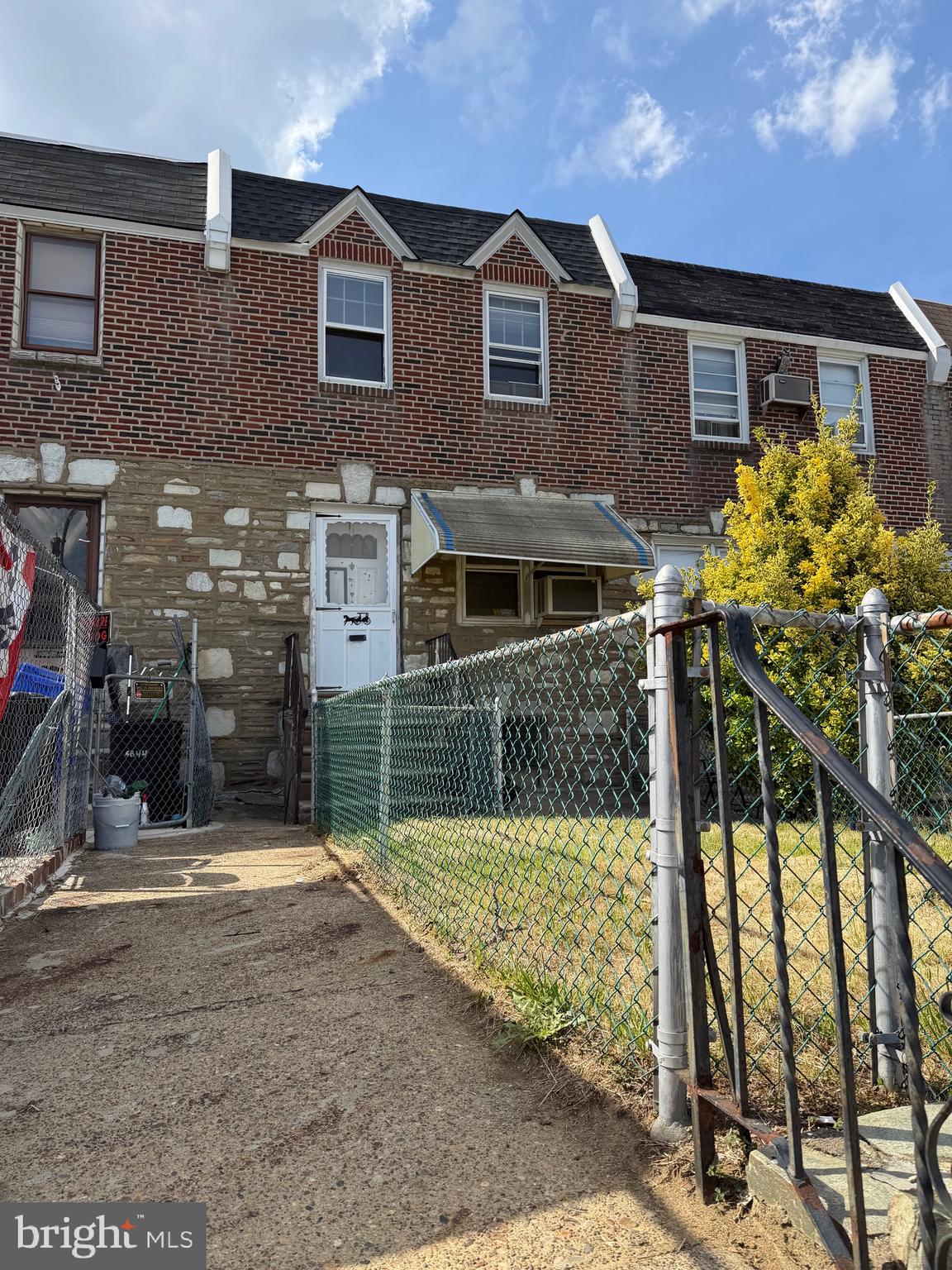 Spacious Brick and Stone airlite home in Tacony.  Features  fenced in front yard,  living room, an open dining room and kitchen.  Second floor with 2 bedrooms and hall bath.  There is an unfinished basement, laundry room and exit to the fenced rear yard, driveway and garage...Great potential, needs work and being sold in  "AS IS" Condition!