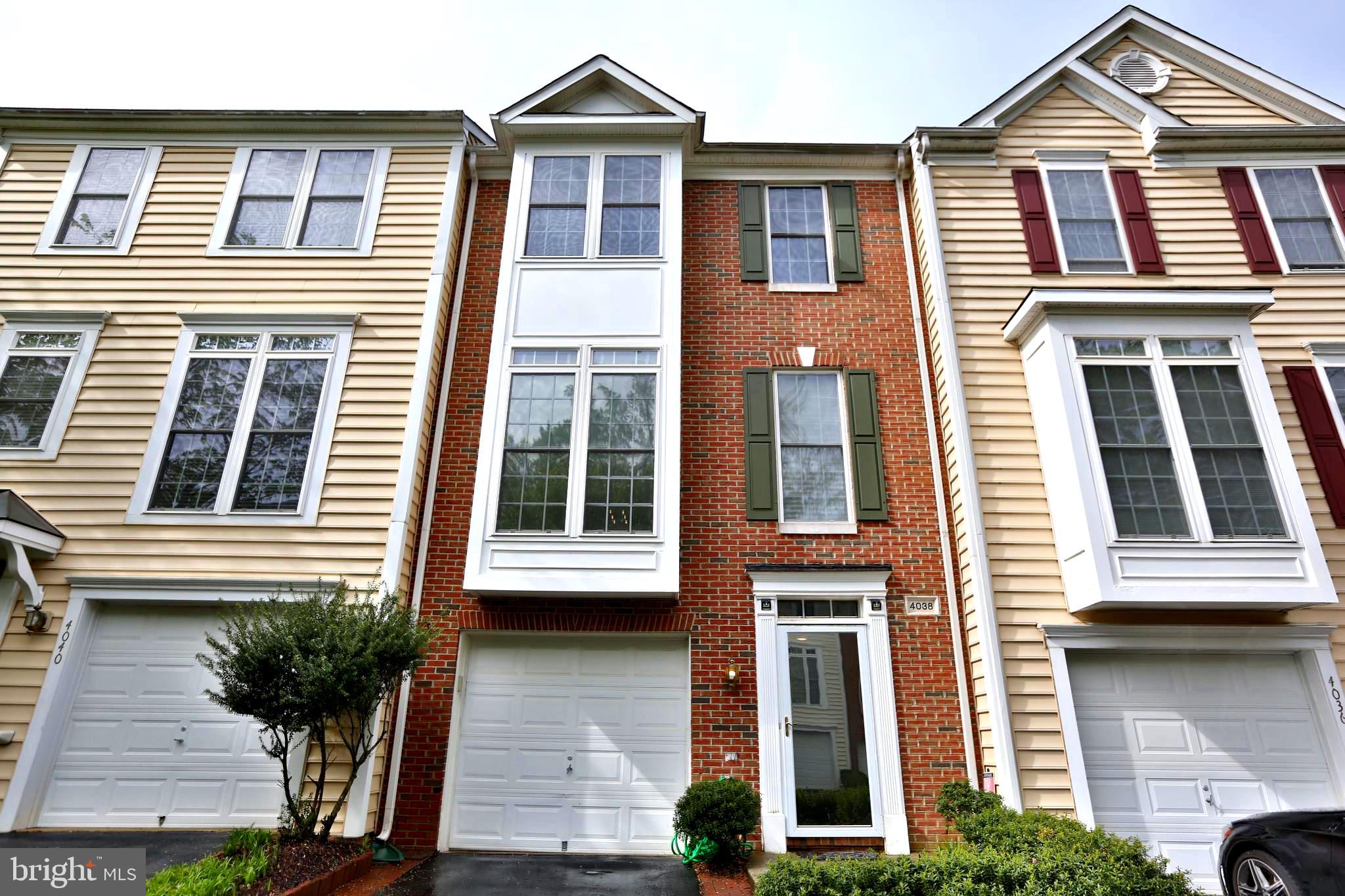 Brick-front garage townhome available for rent in the heart of Fairfax. This beautiful home includes front and rear bump-out features up to the 3rd level for spacious living. The kitchen is well-equipped with an island cook-top, wall oven, stainless steel refrigerator, brand new dishwasher, and plenty of cabinet storage. Upper level features two bedrooms with shared bath and master suite with a luxurious bathroom; soaking tub and tile shower. This is a well-maintained home in pristine condition (with brand new HVAC unit) that is in a centralized location. The property is half-mile walk to Wegmans, 1 mile to Fairfax Corner, H-Mart, Walmart, Fair Oaks Mall and Fairfax Government Center. Convenient from Centreville, Gainesville, and Chantilly. Easy access to route 50, route 29, I-66 and Fairfax County Pkwy. Community amenities include outdoor pool, walking paths, ponds, and trash/snow removal. Woodson High, Frost Middle, and Fairfax Villa Elementary. Property is currently occupied with tenant leaving the property in on April 30th. Please contact for showings and occupancy beginning on May 1. Interested parties must submit an application via Zillow.