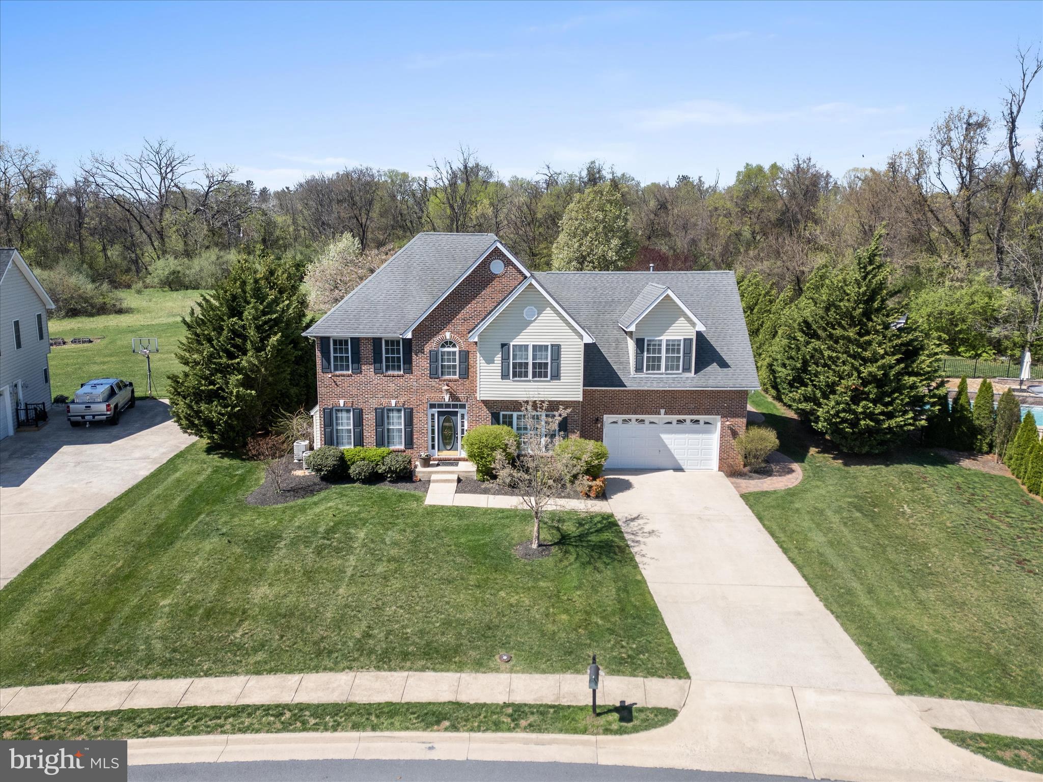 Welcome to 205 Tyson Drive – A Pristine Retreat in Berryville’s Sought-After Hermitage Neighborhood

Located in the highly desirable Hermitage neighborhood, this beautifully appointed 4-bedroom, 3.5-bath home offers luxurious living on a manicured .45-acre lot with no homes behind you, providing peaceful views and added privacy.

Inside, you’ll find gleaming hardwood floors throughout the main level and a warm, inviting layout. The gourmet kitchen features a gas cooktop, double wall ovens, and a sink overlooking the lush backyard—perfect for the home chef and ideal for entertaining. The home also boasts two gas fireplaces, adding charm and comfort to the main living areas.

Retreat to the expansive primary suite, complete with a walk-in closet and spa-like soaking tub. The additional bedrooms are generously sized, providing ample space for guests, family, or a home office setup.

Enjoy year-round outdoor living with a screened-in porch, and cool off in your private in-ground pool with waterfall. The beautifully manicured lawn and pool area offer a resort-style feel right at home.

This home is pristine, move-in ready, and thoughtfully designed with elegant finishes and timeless appeal throughout. Don’t miss your chance to own this exceptional property in one of Berryville’s most coveted communities.