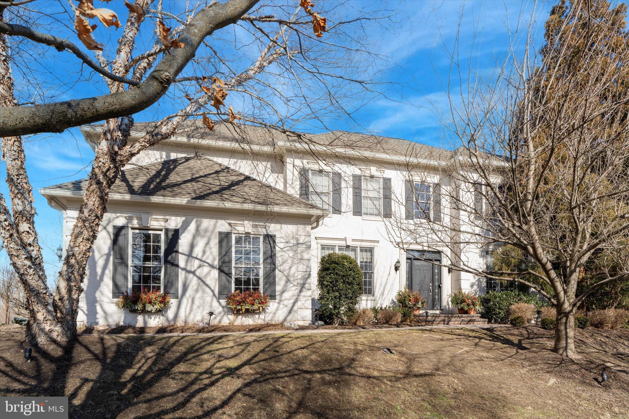 This stately home is situated on a sizable corner lot, in the sought-after community of ‘Reserve at Lafayette Hill’.  With over 4,500+ Square Feet of living space, this home has more than enough space for your family, and an incredibly flexible floorplan to suit your individual needs.  Boasting a one-of-a-kind layout in this community, you will find 5 bedrooms each with their own personal bathroom! Thoughtfully updated and lovingly maintained throughout ownership, you’ll appreciate the attention to every design detail.  A stunning 2-story foyer welcomes you, and you’ll immediately notice the diagonally laid hardwood flooring throughout.  The family room shines with a 2-story fireplace, corner windows for tons of natural light, and a stylish curved balcony above.  The chef will never feel left out with this open floor plan.  The kitchen was professionally designed and updated with timeless features, including a gas cooking range with custom hood, a large pantry, and an island that could easily become the heart of the home.  Step outside to the completely private paver patio, a fun environment to entertain family & friends in the upcoming warmer months.  The main floor also features a formal dining room, living room, office with beautiful wood built-ins, mudroom, and half bath.  Head upstairs to find the well appointed Owner’s Suite, including a sprawling bathroom and walk-in closet. The bathroom features doubles sinks and a separate vanity area, situated in front of a window for perfect lighting.  There are 3 more bedrooms, each with their own full bathroom, and a convenient 2nd floor laundry area.  Still looking for more space?  The finished basement is impressive at 1,330 square feet and includes a living/entertainment room, wraparound bar with kitchenette, game room, gym, and another bedroom + full bath.   A pristine garage has shiplap wall storage, and resilient floor tiles.  The roof is 8 years young, and the 2-zone HVAC system was installed in 2015 and serviced in 2024.  Being a corner lot, there is a spacious wraparound yard, most of which is fenced. The mature landscaping creates a great sense of privacy.  Don’t forget to check out the floorplans at the end of the photos, so you can truly see all of the amazing space this home has to offer!  Imagine, having your own estate home in Lafayette Hill with more than enough space for your family, and every amenity you could want!