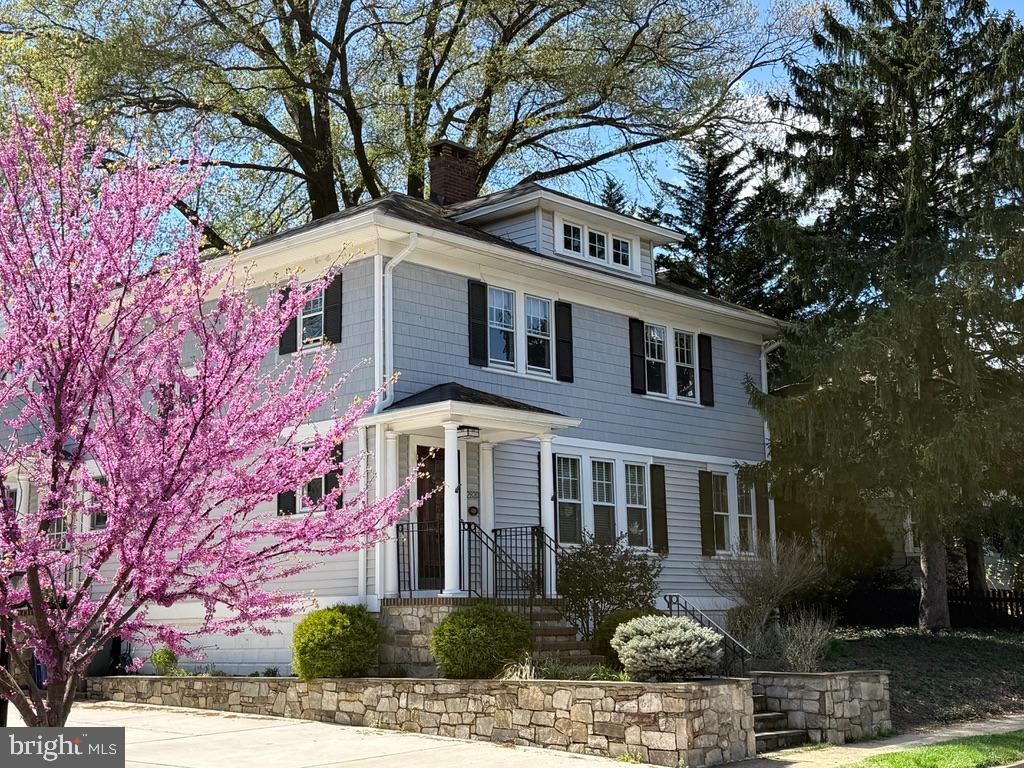 ***Offers due Wednesday, 5/13, at 6pm*** Timeless charm meets everyday comfort in the heart of Lyon Village. Nestled beneath a stunning canopy of mature trees, this inviting 1928 Four-Square beautifully blends classic craftsmanship with thoughtful modern updates. With four bedrooms and three baths, this exceptional home is rich in character, showcasing stacked crown molding, beveled glass windows, period-inspired fixtures, elegant ceiling medallions, an original staircase banister, and gorgeous 3-inch oak floors throughout.
A lovely flagstone and brick walkway leads to the solid wood front door, complete with an antique brass knocker—an entry that sets the tone for the warmth and character found inside. A gracious formal living room, centered around a fireplace with a beautifully detailed white wood mantel and tiered corbels, creates a warm and welcoming place to gather. 
French doors open to a convenient home office, offering a private and inspiring work-from-home space, while the formal dining room easily accommodates gatherings large and small with seating for ten.
At the heart of the home, the sun-filled kitchen is both timeless and functional, bathed in soft natural light and designed for everyday living. Crisp white cabinetry, sleek black countertops, and rich hardwood flooring create an elegant yet comfortable space, opening seamlessly to the expansive family room and casual dining area. French doors invite you outdoors to a private patio and beautifully landscaped backyard—perfect for quiet mornings, alfresco dining, or entertaining guests.
Upstairs, the spacious primary suite offers a peaceful retreat, with room for a sitting area and a spa-like bath featuring a soaking tub and separate shower. Three additional light-filled bedrooms and a well-appointed hall bath provide comfortable accommodations for family and guests alike. A walk-up attic offers excellent storage, while the lower level includes a recreation room, laundry area, wine room, and additional storage space.
Outside, the beautifully designed backyard is framed by handsome retaining walls and complemented by a large detached garage equipped with an EV charger—an ideal finishing touch to this gracious Lyon Village home.