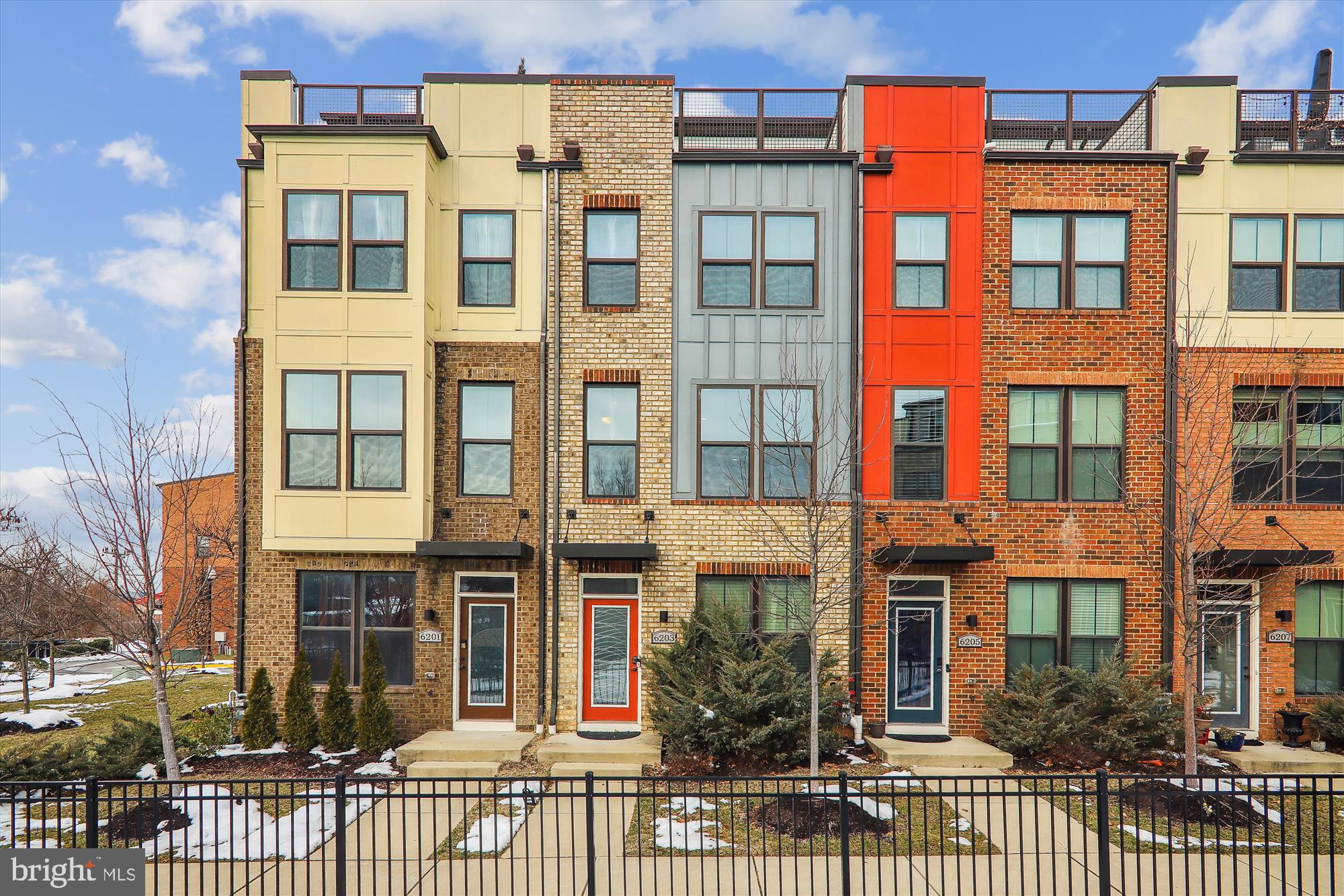 Amazing opportunity to own this LIKE NEW townhome in ideal Hyattsville location near metro (PG Plaza Green Line), shops, restaurants, major commuter routes, DC, and more.  Built in 2017, this light filled unit has a contemporary feel while offering tons of space, neighborhood amenities and wonderful upgrades. Main level boasts open concept living with spacious sunlit living room, upgraded island kitchen with loads of white cabinetry, granite countertops, stainless appliances, and large table space - truly spectacular.  Main level also offers lots of storage including pantry and coat closet, powder room and small composite deck off of dining room - the perfect spot to enjoy your morning coffee.  The upper level hosts a primary suite with an attached en suite bath featuring double sinks and oversized shower, walk-in closet.  Also located on the upper level is a second bedroom with large closet, full bath with tub and stacked washer dryer in hallway. The top-level features a one-bedroom suite with a walk-in closet, a full bath and a light filled loft that opens to a rooftop deck with breathtaking views of the community. Ground level, rear-entry, two-car tandem garage is an extra bonus offering space to park two cars plus lots of room for storage and utility. Enjoy community amenities - dog park, tot/lot as well location that is blocks to several commuting options.  Don't let this one pass by!