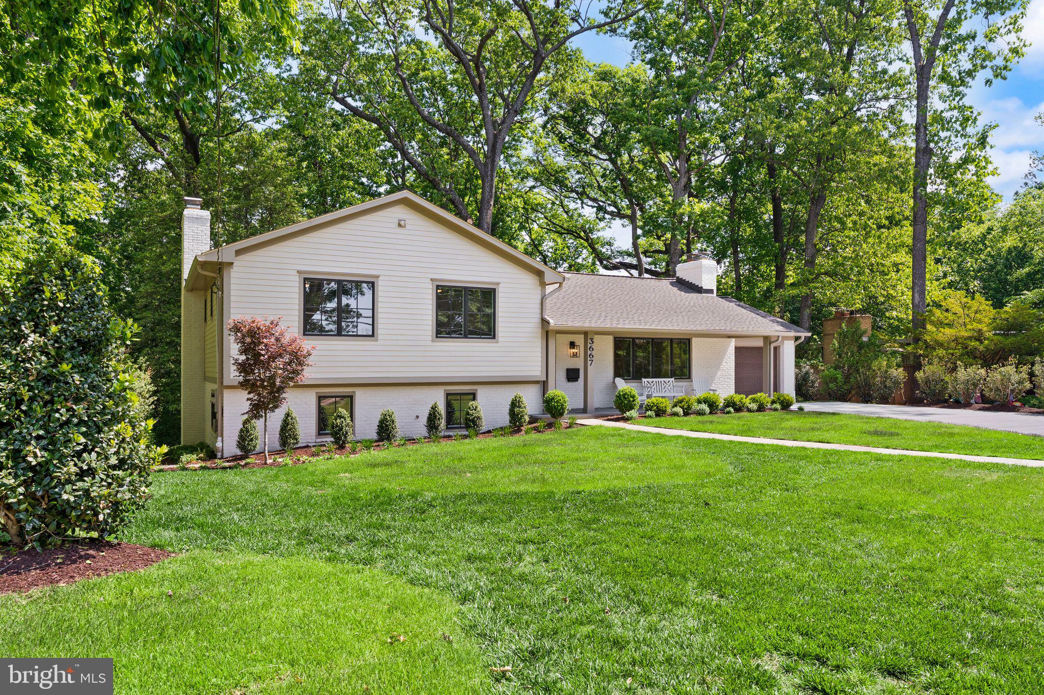 Rare opportunity in the heart of North Arlington, this beautifully renovated home sits on a private, park-like .72-acre lot surrounded by mature trees and professional landscaping with ample space for a FUTURE POOL and POOL HOUSE, SPORTS COURT or additional outdoor living areas.. COMPLETELY RENOVATED inside and out, the 4-bedroom, 3-bath residence offers four levels with every detail thoughtfully updated for modern living. Highlights include a fully renovated designer kitchen with high-end Thermador appliances, updated bathrooms, replaced windows and doors, refinished hardwood floors, luxury vinyl plank flooring, recessed lighting, and ceiling fans throughout. Light-filled living spaces include a spacious sunroom with treetop views, a welcoming family room, and a separate recreation room. Exterior improvements include a new concrete driveway, flagstone walk, front porch, and expansive patio designed for outdoor entertaining.  Ideally located across from Williamsburg Middle School and Discovery Elementary School with easy access to Washington, parks, shopping, dining, 2 playgrounds, a basketball court, 2 turf fields and more!