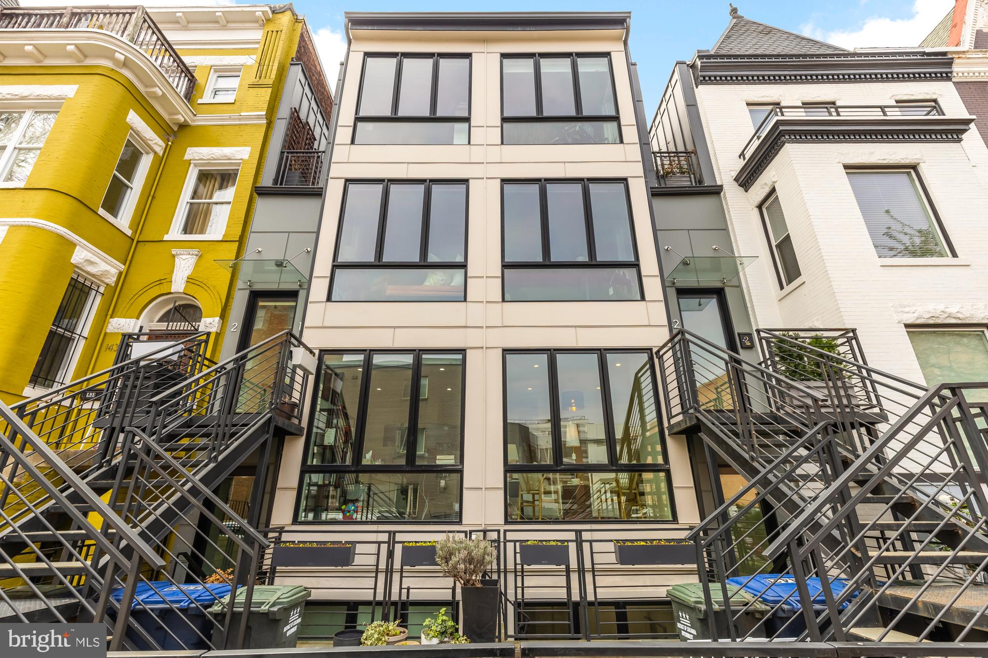 Welcome to an exquisite blend of luxury and modernity at this light-filled 3-bedroom, 3.5-bathroom residence in the vibrant heart of Columbia Heights. With over 1,600 square feet of living space, this home offers the expansive feel of a townhome within the ease of a condo lifestyle.

The moment you enter, you'll be struck by the grandeur of soaring 10'+ ceilings and the abundant natural light pouring through floor-to-ceiling windows. The open-concept layout seamlessly connects living, dining, and kitchen spaces, perfect for both intimate gatherings and grand entertaining. The gourmet kitchen is a chef’s paradise, featuring premium quartz countertops, sleek Bosch stainless steel appliances, a large pantry, a gas cooktop, and a spacious island ideal for socializing. Lustrous oak hardwood floors grace the main level, leading to a private patio.  Rounding out the main living space is a half bathroom adding convenience for both  everyday living and guests .

Upstairs, the primary suite offers a sanctuary with a walk-in closet and a spa-like ensuite equipped with a waterfall shower and dual vanities. Enjoy your own private yard and additional patio accessed from the primary suite. A second generously sized bedroom  and luxurious hall bathroom completes this level. An additional 3rd bedroom and full bathroom are on the lower level, which includes a large closet (and don't miss the back storage area from the closet -- you will be amazed by the size!) 

This residence is technology-forward, featuring an integrated sound system (both indoor and outdoor) and smart home security for unparalleled convenience and peace of mind.

This extremely walkable location is just blocks from METRO and surrounded by Columbia Height's finest dining, shopping, and entertainment, as well as a short walk to all that downtown Mt. Pleasant has to offer!