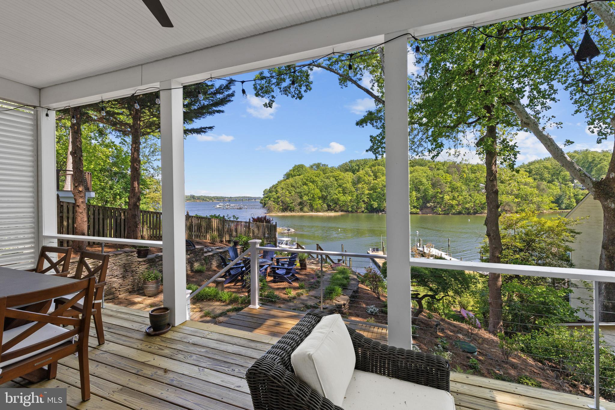 Picturesque Craftsman-style waterfront cottage in Epping Forest! Mornings begin with coffee on the porch as the water glistens across Saltworks Creek and stretches out to the Severn River, while evenings are spent gathered by the firepit, watching boats drift by under painted skies. Welcome to effortless waterfront living in the private, gated community of Epping Forest where every day feels like a getaway and every detail is designed for ease.

This completely renovated property offers the perfect balance of charm, comfort, and low-maintenance living, making it an ideal full-time residence or lock-and-go retreat. New owner’s thoughtfully completed the whole house renovation in the last year, with additional second floor Restoration Hardware full bath, creating beautiful 2nd upper level bedroom suite, updated kitchen and appliances, new first floor flooring, custom designed kitchen pantry and primary bedroom closet by Chesapeake Closets, raised lower level ceiling to 10’, fresh paint inside and out, all decks and staircase to water polyurethaned, significant landscaping and hardscaping of entire property with expanded driveway to 3-4 cars, new Ring security system and Leaf Gutter system, and more! Previous owner recent improvements in last 1 to 2 years include, new second floor dormer, covered balcony, windows and flooring, new primary bedroom full bath and lower level full bath with Restoration Hardware, new 1st floor gas fireplace and mantel, new roof, new pressure treated stairs to water, new deep water 50’ floating dock with water and power. The home is move-in ready and designed to maximize both lifestyle and convenience.

Inside, tall ceilings and walls of windows invite natural light to pour in while framing the surrounding landscape and wide, open water views. The open floor plan creates an easy flow between the gourmet kitchen, dining area, and living room with fireplace, all seamlessly extending to the waterside covered porch, an inviting space for al fresco dining, morning breezes, or unwinding after a day on the water.

Upstairs, two ensuite bedrooms provide private retreats, including a serene primary suite with its own balcony overlooking the water, perfect for capturing sunsets and summer breezes. The lower level offers additional flexibility with a family room, guest bedroom, and full bath, ensuring plenty of space for visiting family and friends.

Outdoors, the boating lifestyle takes center stage. The recently built deep-water floating dock with a 50-foot slip, complemented by a dedicated mooring ball, creates an exceptional setup for effortless days on the water with quick access to the Severn River, Annapolis Harbor, and the Chesapeake Bay beyond.

Epping Forest enhances the experience with a vibrant, amenity-rich setting, offering a clubhouse with waterfront dining, deep-water marina, sandy beach, boat ramp, tennis courts, and scenic walking trails, along with a full calendar of social events and clubs. All just minutes from downtown Annapolis and convenient commuter routes, this is a rare opportunity to enjoy a truly turnkey waterfront lifestyle in one of the area’s most cherished communities. Epping Forest is a Special Tax District ($2,934.96/yr.) with binding Rules & Regulations. Welcome Home!