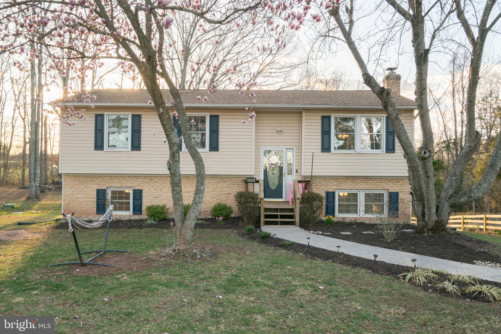 Welcome to this stunning, updated home in the sought-after Nokesville community. Situated on a private 1-acre lot, this home boasts a multitude of desirable features. Step outside onto the new screened porch with a trex deck and stairs leading to the backyard. Other recent upgrades include a newer roof (2017), updated Hvac (2014), hot water heater (2019), and new septic system components (installed in 2019). Brand new electrical  panel installed 2019.
The main level of the home showcases beautiful wood floors, a fully updated kitchen with stainless steel appliances, backsplash, upgraded counters, and movable island. Updated bathroom with modern fixtures and tile flooring.  Three nice sized bedrooms with abundant natural light complete the main level.
The lower level has been completely renovated with new vinyl plank flooring, a wood stove, and a snack bar area with a beverage cooler. The spacious 4th bedroom offers additional storage and can also be utilized as a workout room or office. Additionally, there is a large laundry room/mudroom and a walkout to large level lot from lower level rec room area. 
Windows and doors have also been upgraded throughout the home, providing a bright and inviting atmosphere.
This home is a rare find and won't last! Prince William golf course directly across the street.