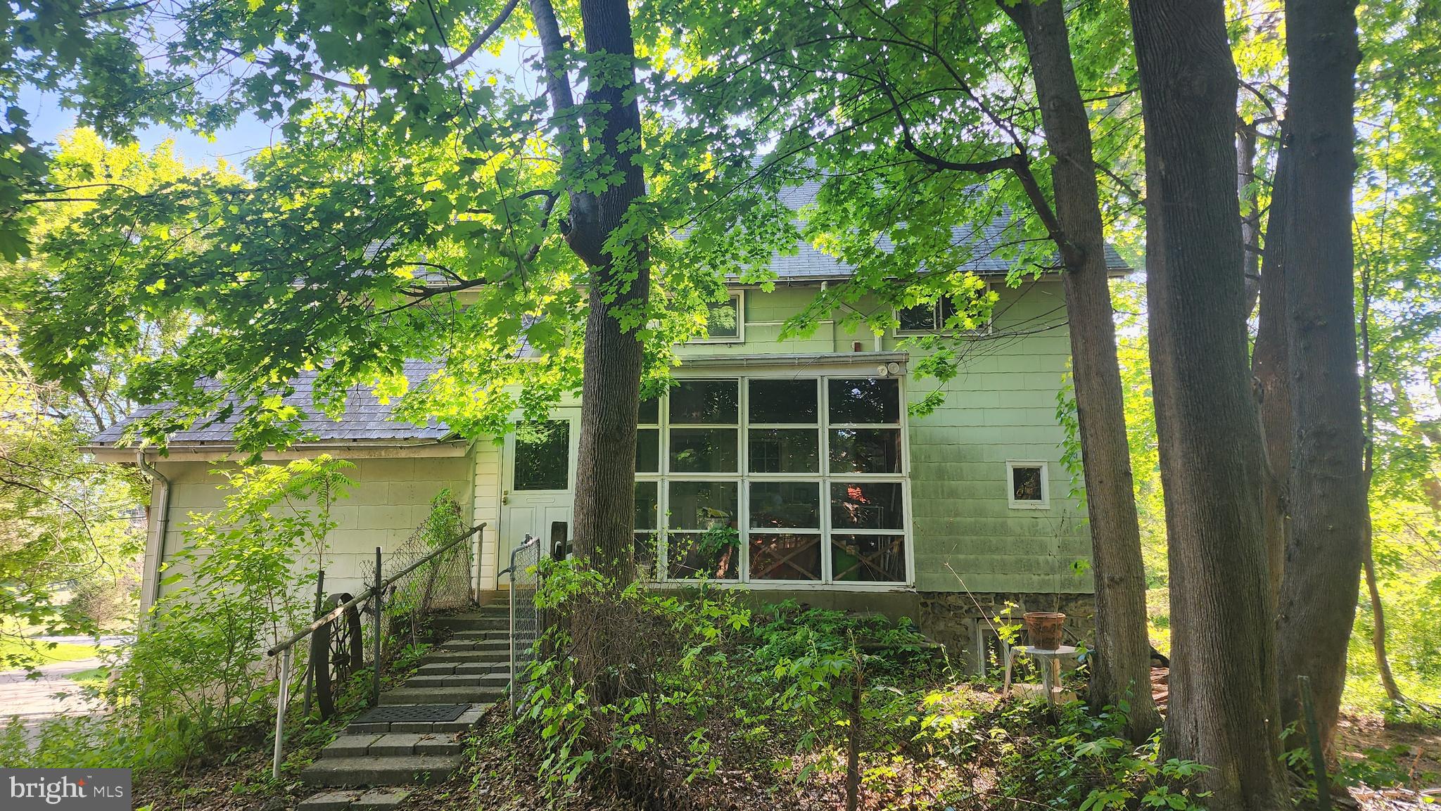 Calling all contractors, renovators, and visionaries—this one-of-a-kind historic property is ready for its next chapter. Originally an old barn converted into a home many years ago, this spacious residence offers incredible potential to be transformed into a stunning showpiece on over one acre. With 5–6 possible bedrooms, 1 full bath and 2 half baths, generous room sizes, and plenty of flexibility to reimagine the layout, the possibilities are wide open. The full third floor is ready to be finished for additional living space, while the above-grade lower level at the front of the home offers even more opportunity for expanded use. A two-story garage with a second floor adds valuable workspace, storage, or future potential. Bring your creativity, craftsmanship, and vision to restore and renovate this unique property into a beautiful historic home with character, space, and endless possibilities.