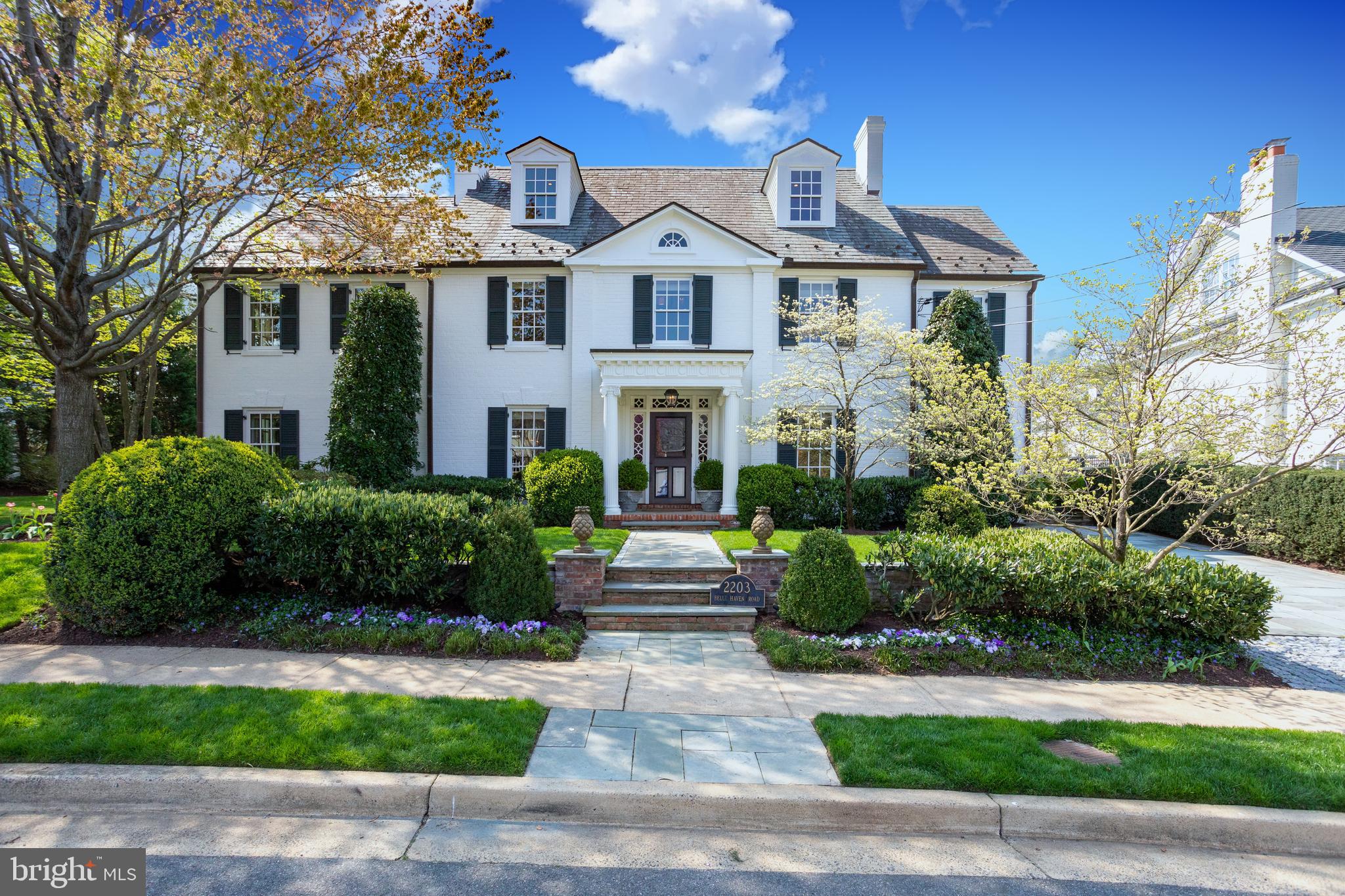 Only the extraordinary in this spectacular Belle Haven estate.  No detail was missed during the renovation of this timeless and palatial residence.  Masterfully designed, the stone lined path welcomes you to the storybook portico with distinctive millwork.  Once inside, natural light from the upper-floors spills down the two-story spiraling staircase and invites you to explore the home’s more than 6,000 square feet of open and bright living space.  The main entry foyer sets the tone for this impeccably maintained estate leaving an everlasting impression for the most discerning of guests.  The formal living and dining rooms are connected by a charming double-sided wood-burning fireplace with a historic 17th century carved Scottish mantle on one side.  The luxurious chef’s kitchen boasts Bosch, Viking and Sub-Zero appliances and a gracious built-in nook — seamlessly adjoined to the family room by stunning herringbone pine floors.  All six bedrooms in this refined, yet warm residence are located on the upper levels.  The owner’s suite of rooms features an entry foyer, sleeping quarters with gas fireplace, separate dressing room with dresser island and mirrored cabinets, and sitting room or office with access to a beautiful outdoor covered porch.  The owner’s bath transports you to a calming spa-like oasis with soaking tub and custom built sink and cabinetry.  The upper level laundry room includes two washers, two dryers and a convenient island for sorting and folding.  Situated on a meticulously landscaped double lot with fully automatic irrigation, this home's idyllic exterior and commanding curbside appeal is only matched by the abundance of sophisticated details found within.  Moments from historic Old Town Alexandria, a hop over to the Mt. Vernon Trail, six miles to Reagan National Airport and eleven miles to Washington, D.C. this exclusive offering is rare and one not to be missed.