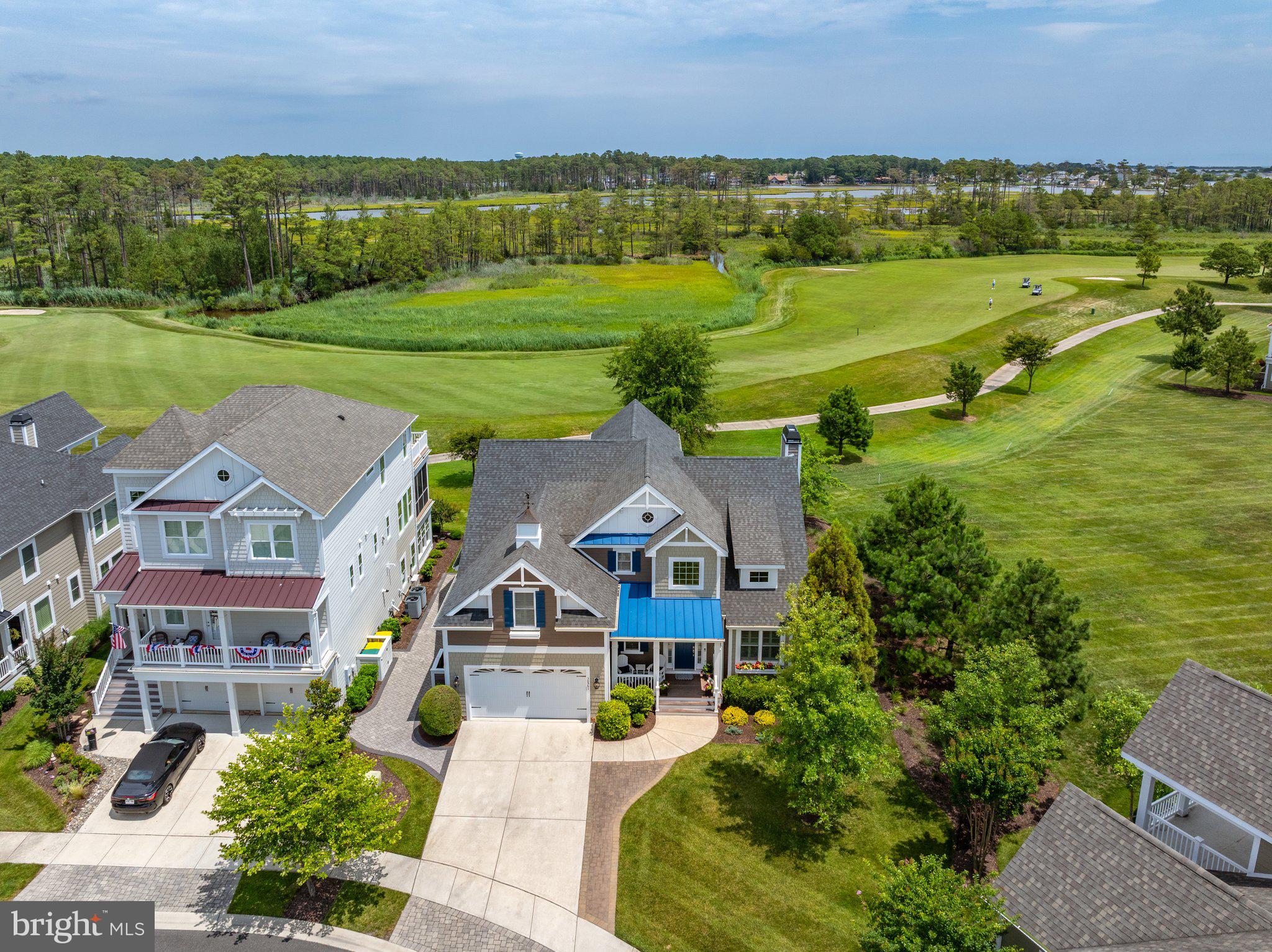 More photos coming soon. Welcome to the elegant yet refreshingly relaxed coastal lifestyle at Bayside Resort Golf Club, proudly recognized as Delaware’s #1 community and the state’s #1 Golf Course. Built by Schell Brothers, one of Delaware’s premier luxury homebuilders, this exceptional Kingfisher model seamlessly blends timeless design, outstanding craftsmanship, and modern functionality. Perfectly positioned on a premium homesite overlooking the award-winning Jack Nicklaus Signature Golf Course, this spectacular residence enjoys sweeping views of the 14th fairway and breathtaking sunsets. One of this home's unique features is its proximity to a large open common area, which is a perfect setting for tossing a football or playing other lawn games. Offering approximately 3,975 square feet of thoughtfully designed living space, this classic contemporary home is one of the most sought-after floor plans. Designed for effortless first-floor living while providing abundant space for family and guests, the home features four generously sized bedrooms, including two luxurious owner’s suites, 3.5 baths, a dramatic great room with soaring cathedral ceilings, a gas fireplace with heat blower and fully custom-made mantel, sun-filled four-season room, bonus room with a charming bay-window bump-out, and an expansive loft ideal for additional living. Two-foot extensions in the kitchen, great room, and dining area further enhance the home’s spacious, open-concept design. At the heart of the home is a beautifully updated gourmet kitchen featuring a large quartz center island, premium Wolf gas cooktop, abundant cabinetry, and designer lighting. The impressive list of upgrades continues with hardwood flooring; five professionally designed custom closets—including two walk-in closets, a custom pantry, a guest closet, and a storage closet; and a beautifully appointed laundry room featuring custom cabinetry and a granite countertop. The first-floor powder room has also been tastefully upgraded with a new vanity, faucets, and toilet, and can be easily converted into a full bath. Custom plantation shutters throughout the home provide timeless elegance and privacy. Outdoor living is equally exceptional, featuring attractive stone paver walkways, an expanded driveway with additional parking, professionally buried downspouts for optimal drainage, and an oversized garage (with a 4-ft extension) complete with durable polymer tile flooring and a custom-built overhead storage loft. Beyond the home itself, you’ll enjoy an unparalleled resort lifestyle just 4 miles from the DE beaches. Bayside offers an extraordinary collection of world-class amenities, including a state-of-the-art Health & Aquatic Center with a heated, five-lane indoor pool and expansive fitness center; tennis, pickleball, bocce, and basketball courts; 4 luxurious outdoor pools, including a splash zone and a waterfall hot tub; scenic walking and biking trails; beach shuttle; and a kayak launch for exploring the area’s beautiful coastal waterways. Just a short walk or bike ride from this home is Bayside’s spectacular clubhouse, featuring Signatures Restaurant, a full-service golf shop, practice facilities, and a vibrant calendar of social events year-round. Also within walking distance is Bayside’s beloved waterfront destination, The Point, home to the popular 38 Degrees restaurant, where you can enjoy waterfront dining and panoramic views of Assawoman Bay and the Ocean City skyline. For music and performing arts enthusiasts, the nationally acclaimed Freeman Arts Pavilion presents concerts, theater, comedy, and cultural performances under the stars throughout the season, adding yet another exceptional amenity to this remarkable community. Combining luxury, thoughtful upgrades, breathtaking golf course views, and an unmatched coastal resort lifestyle, this exceptional residence offers a rare opportunity to experience the very best of Bayside.