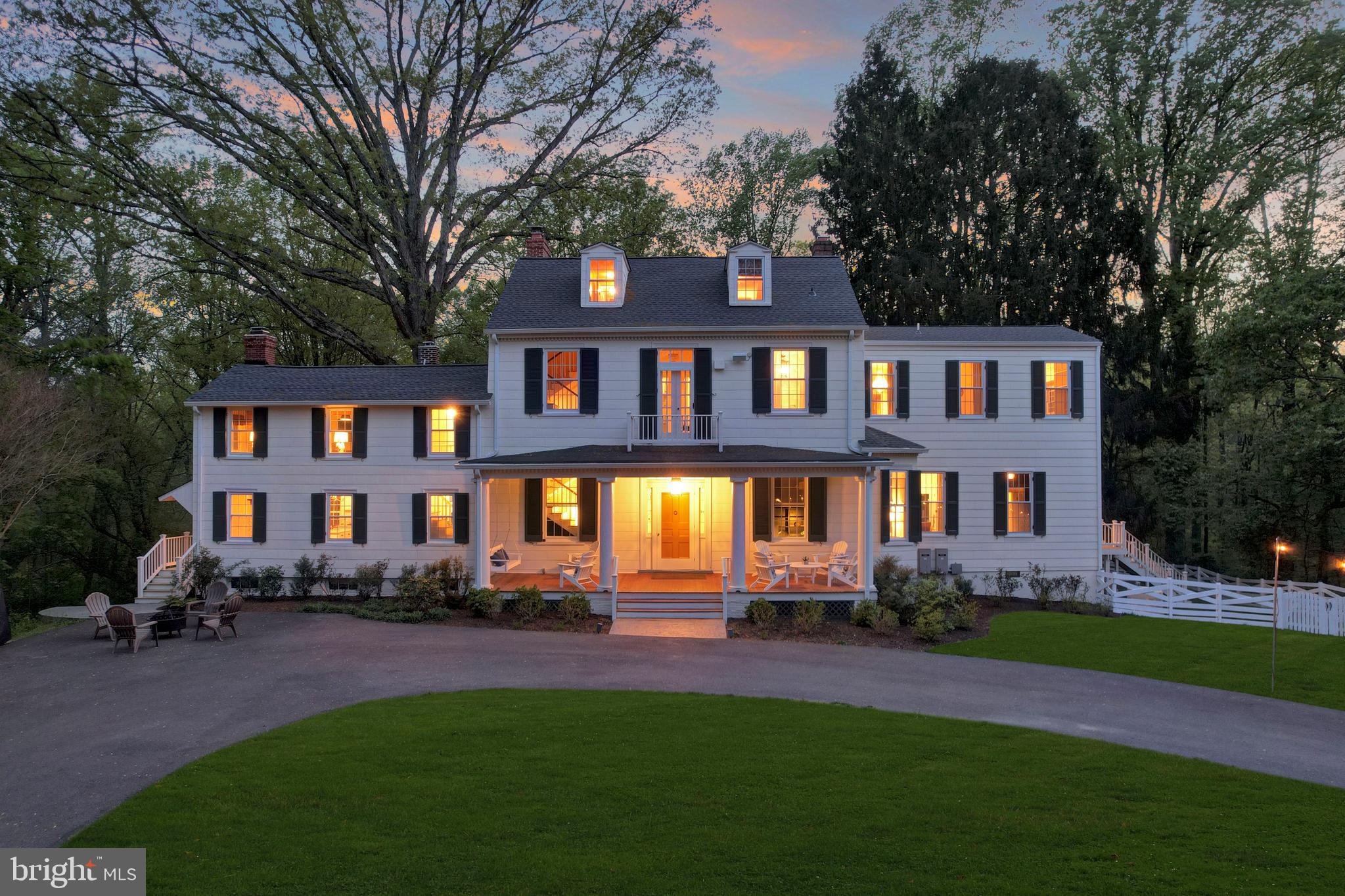 Huge Price Reduction on this modernized Historic home! This unforgettable property offers a truly timeless and peaceful experience but is less than 10 minutes from Historic Waterfront Galesville with dining, shopping, Regatta, antiques, farmers markets and more! As you arrive down the freshly paved circular driveway you can see the house appearing through old-growth trees. In front of the home are gardens and parking for additional vehicles and guests. You’ll see a custom Maryland flag stamped concrete in front of the home, and a stamped concrete path leading around the back to more gardens and a walking path. The entire house has been freshly painted with brand new custom wooden shutters, reproduced to match the historic character. Just picture yourself sipping lemonade on the deep front and back porch porches overlooking your gardens!
Even for the time period, the interior open Foyer and turned staircase were unique, and the Double Parlor design is described in the National Historic Registry listing for this property. On the right side of the Foyer is the original Office with custom bookshelves. Beyond the Foyer are dual parlors containing floor to ceiling french doors that open to a deep back Porch, and large chandeliers which sparkle in the natural light. To the left of the Dining Room, you will find a fully stocked Butler’s Pantry, ready to receive guests with plenty of storage and wet bar. The Kitchen was renovated in 2021 with all new cabinets, appliances and counters, plus a reverse osmosis system. An early 20th century brick hearth fireplace complete with cast iron dutch oven encompasses the back wall. Around the corner from the Kitchen you will see a small Breakfast nook and private porch perfect for enjoying your morning coffee as the sun rises. A Butler’s Pantry and 2nd Half Bath are found at the end of that hallway.
Oakwood was renovated in 2019 with a two story addition to the right side of the house. On the main level, this addition leads from the Formal Living Room to the Family Room/Study. 11’ bookshelves containing a secret hidden door lead to another half bath, and private mud room entrance.
On the second floor above the Kitchen you’ll find the first spacious Guest Bedroom and full Hall Bath. Another large Bedroom backs to the newer Primary Suite beyond, with a second Full Bath at the end of the hall and main staircase. Both Bedrooms are fit for royalty! The Primary Suite boasts a newer gas Fireplace, as well as luxurious Primary Bath nearly as large as the bedroom itself. Be ready to pamper yourself in the freestanding tub before a roaring gas fireplace and custom mantle, or shower in the oversized open tiled walk-in shower. Your custom closet around the corner from the double sinks can hold all of your clothing and laundry needs.
The third floor contains two more special Bedrooms, quiet and private, with much natural light as in the rest of the home. Beyond the beauty of the home’s interior, many new updates and upgrades make this incredible home a mix of old world and modern living. All baths and Kitchen were renovated/updated in 2020-2021. New Roof in 2024. The home went through a full electrical upgrade in 2021 with two new Leviton 200 amp fully automated panels and a new transformer. Never fear a power outage with the outfitted 26kw LPG Generac Generator. Just a few of many upgrades- check the documents section for a full list! Live, Work, Play....this home has it all. While the current owners have occupied the home, it has amazing potential for Event Planning, Short-Term Rental Income, and more. Located 15 minutes from Annapolis and within 45 minutes of Washington, D.C. and Baltimore. Don’t miss the chance to dine on crabs by the water in nearby Galesville, Shady Side or Deale. Looking for a place to launch your boat? Oakwood is 10 minutes from West River Sailing Club & Hartge Yacht Harbor.