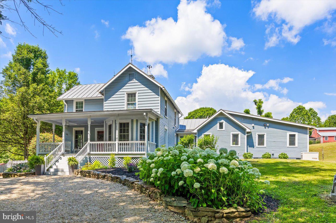 There is more than meets the eye at Black Walnut Farm. Its true beauty is found in the subtle details and hidden gems located throughout the property. Built in 1900, this farm house has undergone a complete renovation both inside and outside and dons a brand new metal roof. Pulling into the property, your eye is drawn to a relaxing pond with a floating deck surrounded by trees. Whether you want to catch a catfish or simply sit on the dock at dusk and listen to the frogs croak, the pond offers a respite of peace and tranquility. Entering the house, a vibrant, detailed mural greets you with a snapshot of how the farm originally looked. The painting meanders its way up the original staircase to the second floor which offers two cozy bedrooms and a full bath; perfect for the kids or house guests staying for a visit. The first floor is truly a picturesque modern-industrial farmhouse with hardwood floors throughout. A spacious office area overlooks the front of the property and Starlink internet connects you to the world beyond. Throughout the house, the rooms flow into one another with grace and a feeling of effortless movement. The primary bedroom and its spectacular tiled bath will leave you refreshed and ready for the day. The kitchen, with all new appliances, double sinks, butcher block countertops, and gorgeous island in the middle, overlooks the fenced in garden and greenhouse where your dreams of farm-to-table meals become a reality. The living room is an inviting space with high ceilings, an abundance of natural light, and a little loft nook accessible by a wooden ladder perfect for reading or taking an afternoon nap in the sun. As stunning as the house is on the inside, the outdoor spaces will leave you in awe. The wrap-around porch has a covered al fresco table as the canopy of  wisteria vines float above and is surrounded by raised beds of flowers and plants. There is also a brand new in-ground heated saltwater pool to enjoy during the summer months as well as a hot tub to warm you up on winter nights to stargaze. The pool is complete with a cabana and electricity and sits below an amazing view of Bessie Bell Mountain. The property also has a barn with a loft with a ton of space complete with HVAC, roughed in plumbing, and a garage door. There are also two more sheds to store farm equipment or livestock, an apiary ready to be restored, a small apple orchard, a three-bay equipment shed with office space, and a fenced-in chicken coop. But the real gem of the property lies just beyond all the buildings: the secret black walnut groove. These stunning trees and the space where they sit is an absolute treasure and a place to come and be one with nature. Two open pastures offer more farming opportunities.  Don’t miss your opportunity to own an incredible home and property in Rappahannock and uncover all the hidden gems there are to find.     
With all the peace and quiet that Black Walnut offers you are also close to The Castleton Theater House, Vineyards, Brewery’s, Hiking, Art Galleries and Golf. Home to many restaurants including The Inn at Little Washington, Three Blacksmiths, Coffee and Bakery Shops and a fabulous Farmers Market.  Experience the pinnacle of 823 Scrabble Road, where modern farmhouse living meets luxury living.