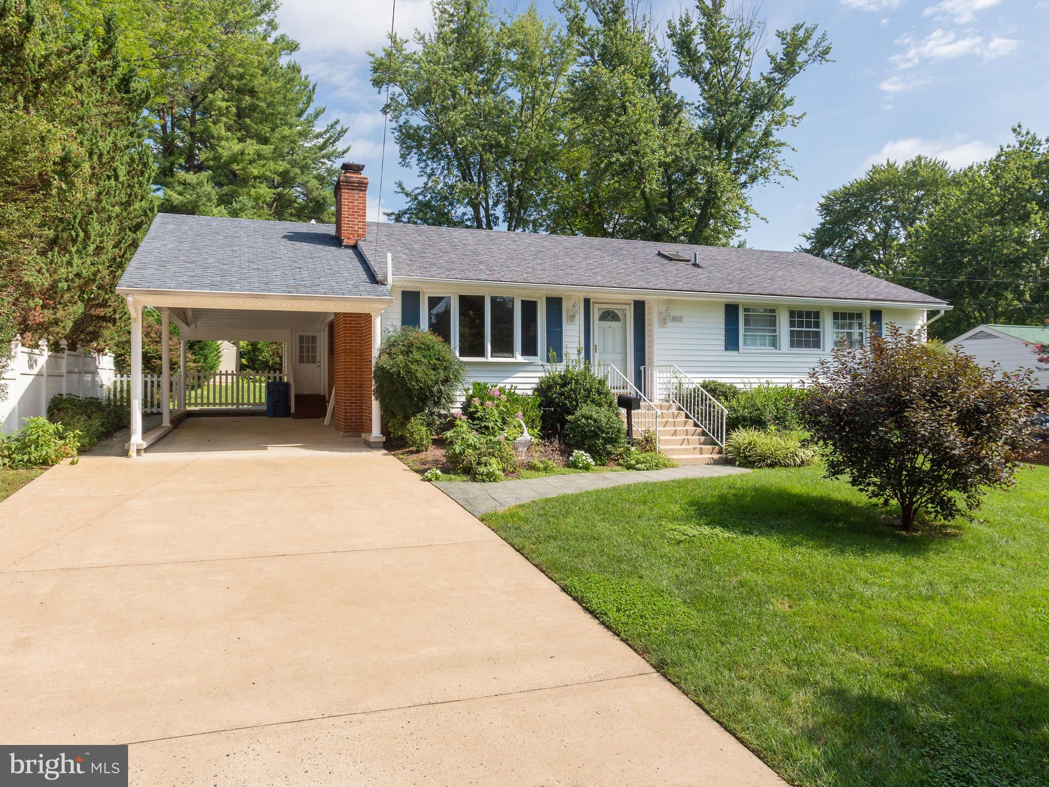 Welcome Home! Located in the desirable Lake Braddock school tier and just one stoplight to I-495, this beautifully updated home features a rare family room addition, providing you with ample space for everyday living or effortless entertaining. Inside the freshly painted home, discover a sizable living room with recently refinished hardwood floors, a cozy fireplace, and a large picture window flooding the home with natural light. The adjacent dining room opens directly into the bright kitchen, featuring updated cabinets, sleek quartz countertops, and a fresh tile backsplash. Pass through the french doors to the expansive family room, where you’ll find a dramatic vaulted ceiling, plush carpeted floors, a second gas fireplace and wall-to-wall windows. Down the hall, the primary bedroom is a calm and elegant retreat with crown molding, ample closet storage, and a renovated en suite bathroom with modern finishes. Both additional bedrooms feature abundant closet space and share access to the second remodeled full bathroom in the hallway. Downstairs, the vast carpeted recreation room with recessed lighting is a great versatile space with endless opportunities to fit your lifestyle. The fourth bedroom and elegant third full bathroom on the lower level offer a perfect private space for guests. Rounding out this level of the home is a large storage area, plus an additional walk-in closet and massive laundry room with double utility sinks. Step onto the deck off the family room or pass through the mud room door, and enjoy the lush tree-lined view that surrounds you. This large and flat backyard is ideal for relaxing, playing, or entertaining all Summer long. With a rare carport, ample parking, and so much space, you’ll want to invite friends over to grill or watch the big game every weekend! Major home updates include a new water heater and HVAC (2021) for greater peace of mind. No HOA in this established, close-knit community, though an optional community pool membership is available. Just minutes to Giant, Safeway, Whole Foods, Old Keene Mill Shopping Center, Springfield Plaza, Lake Accotink Park and Trails, Hidden Pond Nature Center, and Springfield Country Club. Quick access to I-495, Braddock Road, Old Keene Mill Rd, the Fairfax County Parkway, and WMATA Express Bus, making it a dream for commuters! In the desirable Lake Braddock Secondary School tier, this updated home won’t be available for long. Schedule a private tour of your beautiful new home today! Offer deadline Tuesday 5/20 @ 5pm