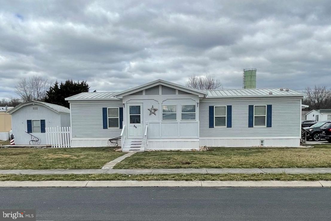 OPEN FLOORPLAN in this double wide home in Walnut Grove Mobile Home Park.   This home is a delight with 3 Bedrooms, 2 full baths, enclosed front porch for additional storage, and rear enclosed porch.   Don't miss this well taken care of home.  Upper Adams School District.  Half-constructed gazebo is reserved and will be removed.