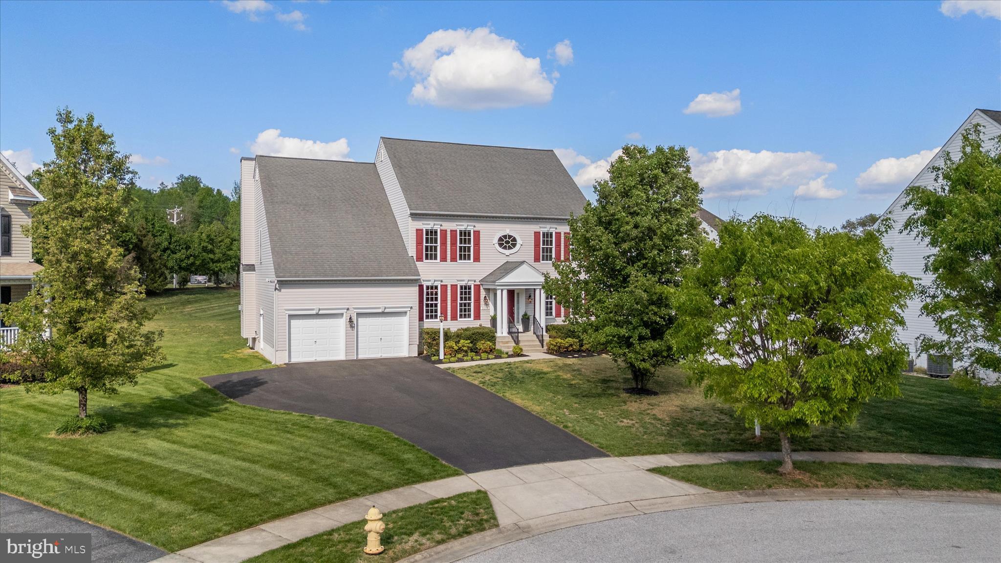 Welcome to this stunning Koch Home “Andover” model, situated on a private 0.35-acre lot. This meticulously maintained colonial offers 4 bedrooms, 3.5 bathrooms, and 3,211 square feet of finished living space.
The main level features a welcoming flow, anchored by an open-concept kitchen equipped with a large center island, and granite countertops. This area seamlessly connects to a bright breakfast area and family room, the perfect space for entertaining. A formal dining room, elegant flooring, and a cozy fireplace add warmth and sophistication to the home’s interior.

Retreat to the primary suite, which offers a private escape complete with a spacious walk-in closet and a luxurious en-suite bath. The home provides a versatile floor plan with ample space for a dedicated home office, recreation room, or media area. Step outside to enjoy the Trex-deck patio which overlooks a private, tree-lined yard, an ideal spot for morning coffee or evening relaxation.

Additional highlights include a two-car garage and easy access to local amenities and scenic trails. To visit, take Riva Rd. to one mile south of the Riva Bridge, then turn left onto Anglesey Dr., located between the Waterford and Cambria communities. This home combines timeless colonial charm with modern comfort in a highly sought-after location.