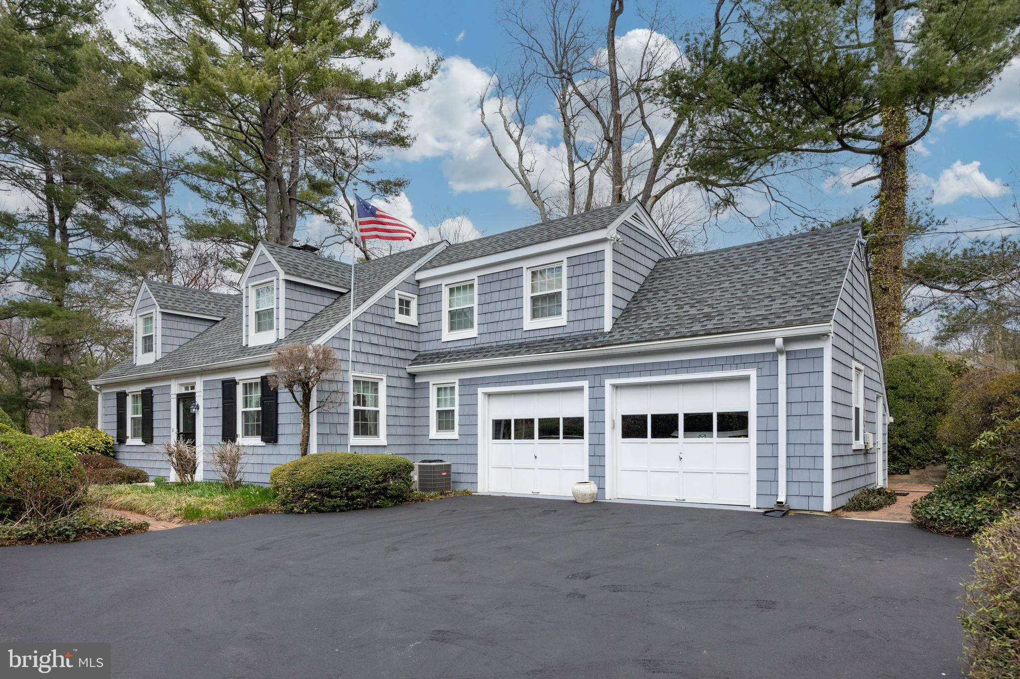Welcome to this stunning home in the heart of Gladwyne, offering the perfect blend of elegance, comfort, and modern amenities. Nestled on a lush, one-acre lot, this beautifully landscaped property features exquisite plantings, creating a serene, private oasis. The home boasts 3 spacious bedrooms, 3 full baths, and a convenient half bath, making it ideal for both everyday living and entertaining.
Step inside to discover gleaming hardwood floors that flow throughout the main living areas, adding warmth and sophistication. The inviting living room features a gas fireplace, perfect for cozying up during colder months. The chef's kitchen is a true standout, with top-of-the-line appliances including a Wolf cooktop, a sleek Wolf wall oven, a Sub-Zero refrigerator, and a Bosch dishwasher, ensuring that your culinary endeavors are always a delight.  Outside, you'll find your own private retreat with beautifully designed patios, offering a perfect setting for outdoor dining, relaxation, or entertaining. A custom paver and stone feature, expertly crafted by Waterloo Gardens, adds an extra layer of charm and elegance to the landscape, making this home truly special.  This property seamlessly combines luxury and comfort in a coveted location, providing an exceptional living experience.