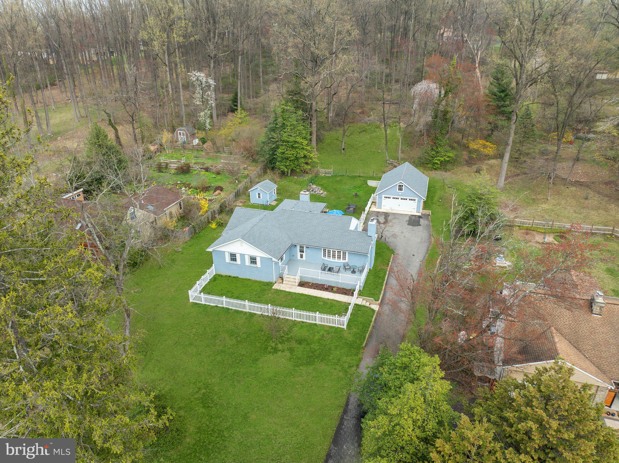 Offer Deadline 10AM Tuesday April 8th. Nestled on just over an acre of land, this charming home offers a peaceful outdoor retreat paired with the ease of low-maintenance, single-floor living. Thoughtfully upgraded over the past few years, it’s truly move-in ready—perfect for buyers who want to start enjoying their new space right away. As you arrive, a newly paved driveway (2022) welcomes you and leads to a newly built 24’ x 36’ detached two car garage, complete with convenient pull-down attic storage that spans the entire garage.

Inside, you'll find 1,825 square feet of beautifully renovated living space. Recent improvements include new drywall, neutral paint throughout, newer windows (2021), a new roof (2020), and additional insulation in the attic and basement rafters for year-round comfort. The front living room is filled with natural light and features a cozy brick wood-burning fireplace with built-ins—an ideal spot to relax during colder months.

The heart of the home is the stunning chef’s kitchen, fully renovated in 2021 with no expense sparred. This kitchen includes high-end stainless steel Bosch appliances, a built in microwave, 6 burner stove, stainless steel hood vent and a farmhouse sink. The large center island with roll out drawers, plenty of storage, and a peninsula with countertop seating for three make it a dream for anyone who loves to cook or entertain. Just off the kitchen, an additional living area provides flexible use as a third bedroom. This space could even be used as a den with its own fireplace, formal dining room, game room, or  home office. This room does provide direct access to the backyard and is being counted as the third bedroom.

The hallway leads to a spacious laundry room, conveniently located on the main level, a beautifully tiled and updated bathroom, and a generously sized secondary bedroom with walk-in closet. The primary suite is large enough for a king size bed and is complete with a newly updated en-suite bathroom featuring a luxurious frameless glass shower that includes bench seating and a large walk-in closet.

The clean, unfinished basement includes a new French drain system and two sump pumps that were installed in 2024 to help ensure the basement stays dry all year round, even during the heaviest rain storms. This space provides excellent storage or potential for future finishing and includes several key upgrades for peace of mind: newer central air and heat pump, bilco doors,  pressure tank and well pump (2017), water filtration system (2020), water softener (2022), propane water heater (2022), oil boiler system (2017), baseboard heating (2021), a new electric panel (2020), and a new oil tank (2022).

Step outside to a spacious patio area, ideal for summer gatherings, and a fenced-in yard perfect for pets. A new 10x10 shed offers extra storage for outdoor tools and equipment, freeing up the garage for vehicles or workshop space. The property also extends approximately 200 feet beyond the fence, offering additional privacy and room to roam. Ideally situated near major transportation routes and shopping areas, this home is a fantastic option for first-time buyers or anyone seeking a comfortable, low-maintenance lifestyle with the benefit of major upgrades already completed. Schedule your showing today—this one won’t last long!