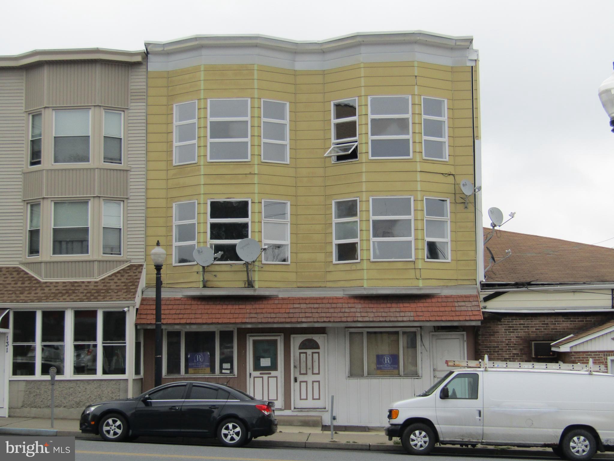 This large apartment building has tons of potential.  The building has a new rubber roof and has been taken back to the studs leaving a clean slate for your imagination.  These multi-unit buildings don't come along often. Huge vacant rear lot offers an ideal area for off-street parking.  With some sweat equity, this building would make an awesome addition to your portfolio providing a great income for years.  Consult borough for zoning use.