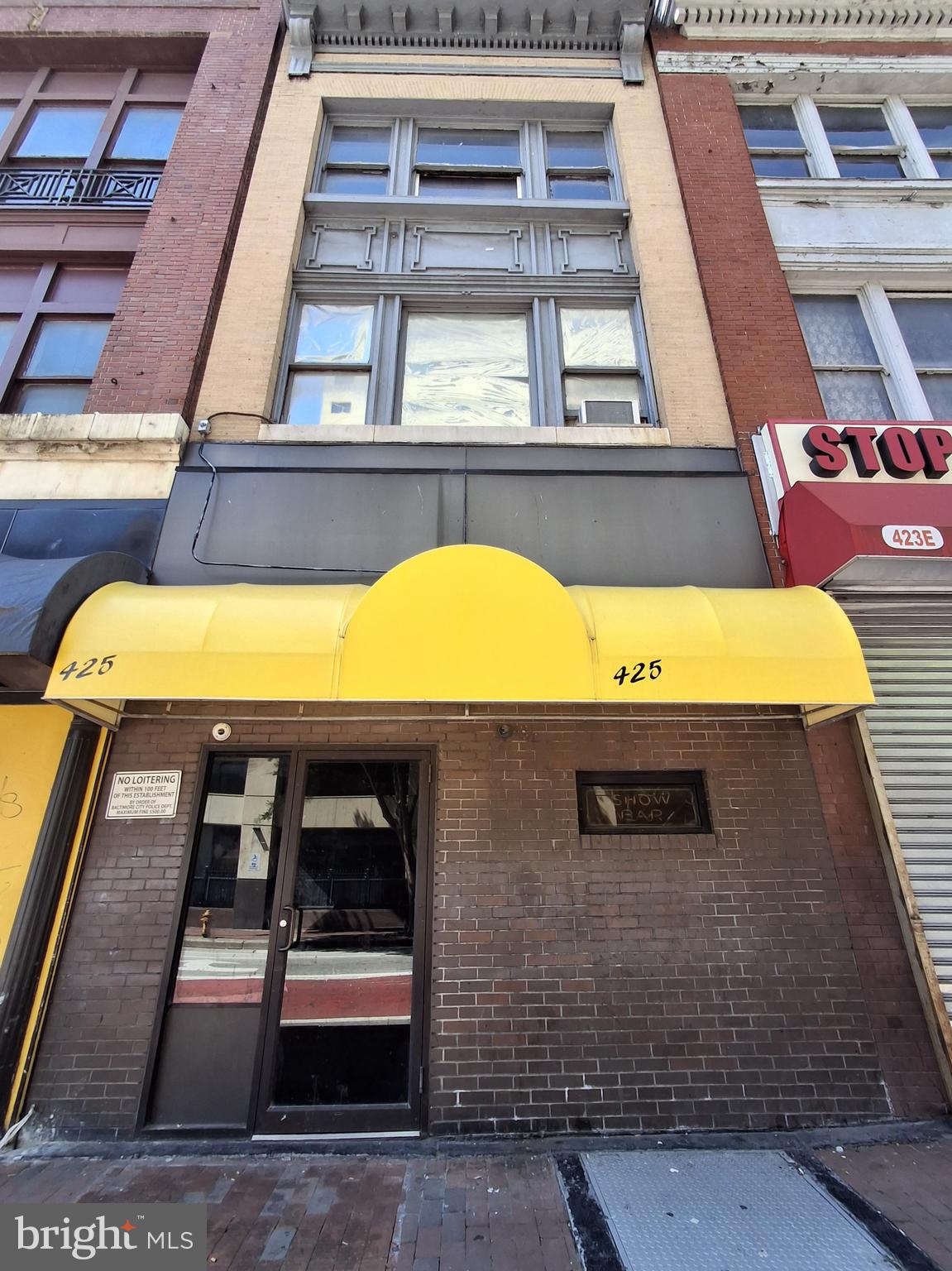 3-story commercial building with over 3,000 sf, 3 blocks from Inner Harbor, near Baltimore City zoning/permit office and police headquarters.  Previously used as a HOOKAH LOUNGE.  BUYER TO VERIFY ALLOWABLE USES.  SOLD AS IS.  LIQUOR LICENSE IS NOT INCLUDED.  IF YOU WANT TO SELL ALCOHOL, YOU MUST OBTAIN OR TRANSFER YOUR OWN LIQUOR LICENSE.  Main level is currently set up with tables, a stage, and a restroom.  2nd floor has an office, locker room, full bathroom and storage.  3rd floor is wide open and unfinished.  There is also an unfinished basement for additional storage.  Each floor is approximately 1,000 sf.  Make your finishing touches and open up shop in this incredible location in the heart of downtown Baltimore.  Also available for rent.