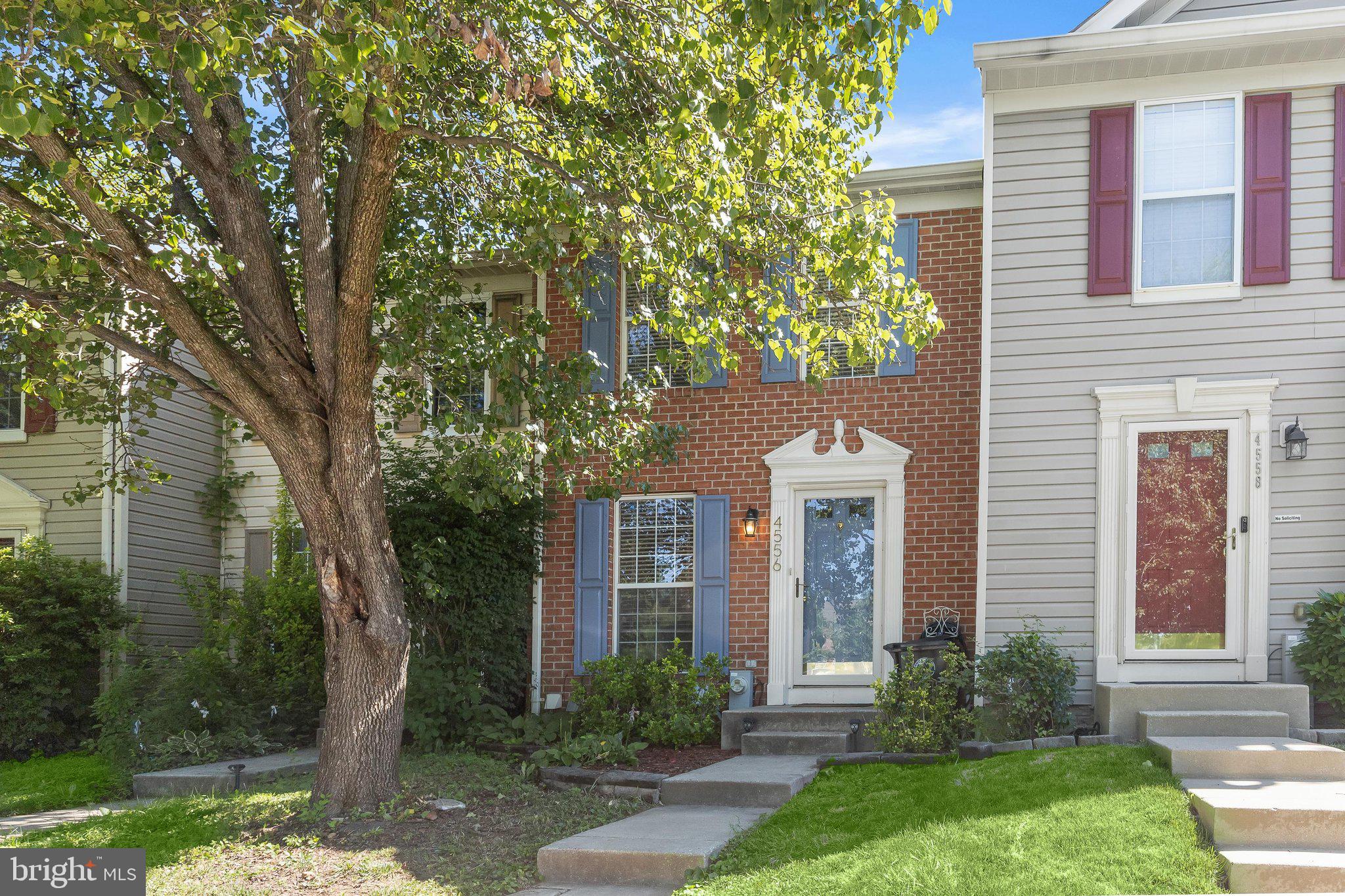 Spacious townhome offering a bright and welcoming floor plan designed for comfortable everyday living. The sun-filled main level features a generous living room that flows seamlessly into the dining area and kitchen, creating an ideal space for gathering and entertaining. A sliding glass door provides access to a private deck, perfect for outdoor relaxation. The kitchen is appointed with warm wood cabinetry, stainless steel appliances, and tile backsplash. Upstairs, two spacious bedrooms both with high vaulted ceilings, share a convenient dual-entry full bathroom. The finished walkout lower level expands the living space with a versatile family room, full bathroom, and laundry area. Step outside to the backyard, which backs to open common area, providing a peaceful setting and added privacy.  Residents enjoy access to a neighborhood tot lot and the convenience of being just minutes from major commuter routes, shopping, dining, and entertainment. This home offers the perfect blend of comfort, value, and location.