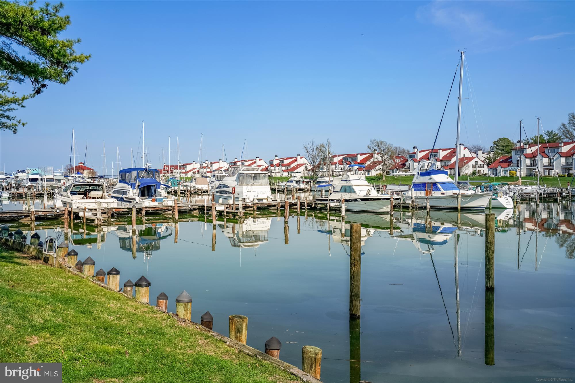 Welcome to Bayside, where coastal living and resort-style amenities come together in one of the area’s most desirable waterfront communities. This 3-bedroom, 2.5-bath condo offers a relaxing marina-side setting with both upper and lower decks overlooking the marina, creating the perfect backdrop for morning coffee, evening sunsets, and everything in between.

Inside, you’ll find a spacious layout designed for comfortable living, complete with a cozy gas fireplace, generous living spaces, and the convenience of a 1-car garage. Recent improvements include a new roof in 2023 and the front foot fee paid off in 2024, as well as a one-year home warranty for the buyer — adding additional value and peace of mind for the next owner.

Life in Bayside is all about lifestyle. Residents enjoy access to resort-style amenities including a clubhouse, outdoor pool, fitness center, tennis courts, volleyball courts, and scenic walking and jogging trails — all just steps from the marina and moments from the Chesapeake Bay.

Perfectly located near waterfront restaurants, local shops, and major commuter routes to Annapolis, Baltimore, and Washington D.C., this home offers the ideal blend of relaxation and accessibility. Whether you’re searching for a full-time residence or the perfect weekend waterfront escape, this Bayside condo captures the very best of Eastern Shore living.