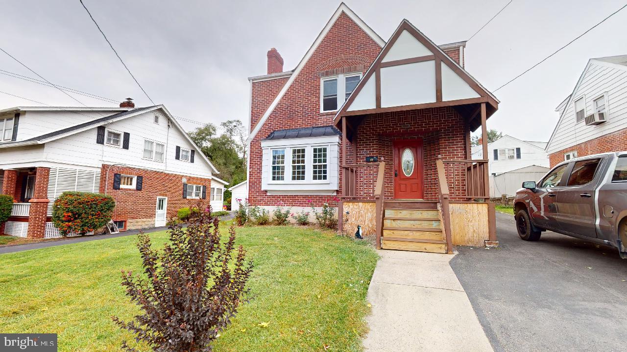 This brick homes gives the charm of yesteryear and the convenience of in town living.  You can be in the mist of Historic Romney.  Schools, Playgrounds, Library, Shopping, Restaurants, Banks, are all within an easy stroll.  The home boast of Wood Floors, Sunporch, 1/2 bath, Dining Room and Laundry on the main floor, Additional Rooms in the lower level along with a Shower.  A small Garage at the end of the off street parking also exist and a great space for mower etc.