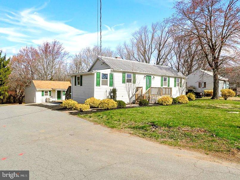 Beautifully renovated rambler and detached accessory dwelling in a great location close to I-270 and within easy walking distance of Cabin Branch ES, parks and the Clarksburg Outlets!

The main home features 2 bedrooms and 1 full bath with tub, large table space kitchen with stainless appliances and attractive custom cabinets, laundry and a formal dining area or den. There is also a great deck and front porch for enjoying the outdoors. New windows, fresh paint, flooring, water heater, washer/dryer and Carrier heat pump. 

The detached accessory dwelling is bright and comfortable with brand new kitchen and bath, nice living area, private bedroom, fresh paint, new windows and floors, mini-split system and tankless water heater. 

Very clean and absolutely nothing left to do!  Please note that total square footage in listing is estimated and combined for both structures. Primary home is 2 bed/1 bath approximately 814sqft and Accessory Dwelling is 1 bed/1 bath approximately 391sqft. The driveway running to the left of the home is a shared driveway easement serving the home behind the subject property.