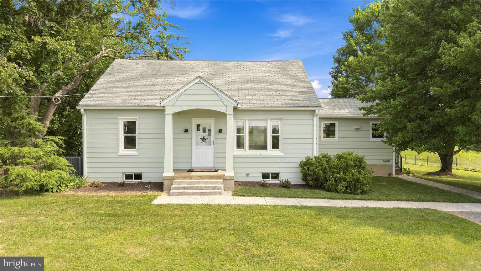 Charming, Thoughtfully Modernized, Cape Cod on 5 Acres with a Barn and Pond  
  This move in ready countryside home is conveniently located near commuter arteries and local points of interest. (1) Traffic light from downtown DC
  The main level has hardwood flooring throughout. The remodeled kitchen features all updated appliances. The (2) upper-level bedrooms have upgraded carpeting. Both full bathrooms have been renovated. The upper-level bath has a tub. The main level bath has a walk-in shower. The basement is open, dry and clean with upgraded large capacity wash and dryer.
  3-year-old central A/C, spray foam insulation, new well pump, hot and cold exterior faucets added during renovations.
Enjoy the view of the property while relaxing on the recently replace 14'X22' rear deck that overlooks a lovely yard, fire pit and mature trees. 
  The Barn (built in 2021) Measures 55'wide X 24'deep X 20'high. 200-amp power (upgradeable) hot and cold water. 
The enclosed portion 24'X30' has concrete floor, heat and air conditioning, and is spray foam insulated. The upper mezzanine (470sf) provides space for an office, game room or storage. The space includes a 10'X10' insulated roll-up door and man door with electronic lock. 
 The open bay area 24'X25' has (2) openings that are 10'wide X 12'7" high. The floor is asphalt millings. (1) 12'X12'X4' storage rack with (3) shelves sitting on concrete.
- RV Pad added 2023 16' wide X 30' long with 50-amp power and water.
The perimeter and entrance of the barn is finished with asphalt millings over road fabric.
  -The properties 4+ open acres are perfect for livestock, horses, hay or even golf practice.