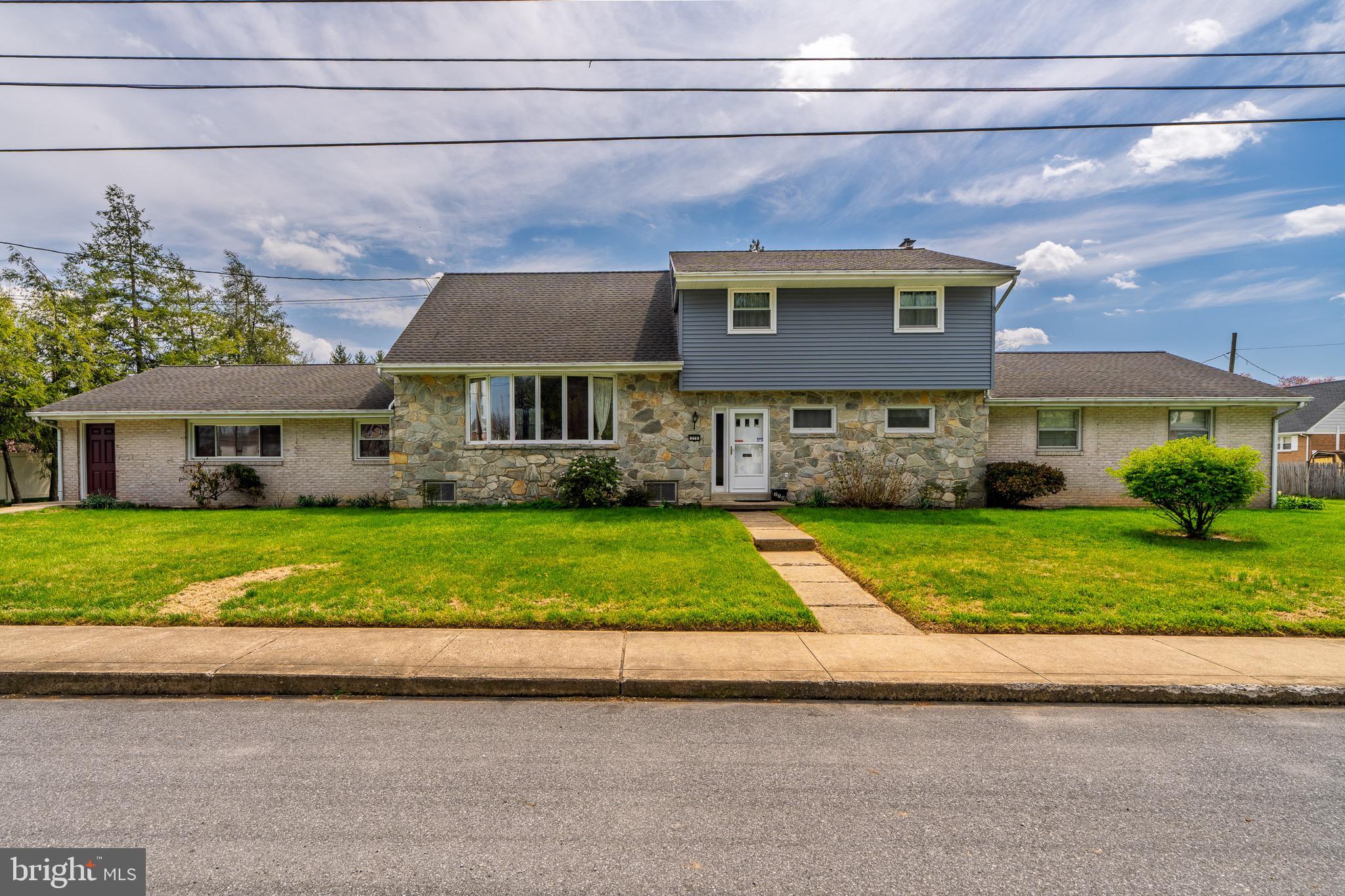 This spacious split-level home offers over 3,000 square feet with a flexible layout designed for both comfort and accessibility. The main living area features an open-concept design with abundant natural light and hardwood floors seamlessly connecting the living room, dining area, and kitchen—perfect for everyday living and entertaining. Tastefully updated kitchen features granite countertops and luxury vinyl plank flooring.
The upper levels provide generously sized bedrooms with hardwood floors, ceiling fans and well-appointed bathrooms, offering privacy and separation from the main gathering spaces. Thoughtful updates and ample storage throughout the home add to its functionality and appeal.
The fully finished main level bedroom is designed with ADA-friendly features, making it ideal for multigenerational living, guests, or anyone seeking enhanced accessibility. With wider doorways, smart home lighting, step-free entry, and a layout that accommodates ease of movement, this space includes a bedroom, full bath, and living area—creating a comfortable and independent environment. Bathroom features roll in tile shower, heated floors and plenty of easily accessible storage space.
Adding to the home's appeal is an energy efficient solar power system paired with a backup generator, offering both sustainability and peace of mind. Whether reducing utility costs or ensuring uninterrupted power during outages, the feature enhances the home's reliability and long-term value.
Outside, the property offers plenty of space to relax or entertain, rounding out a home that balances size, versatility, modern efficiency and inclusive design.