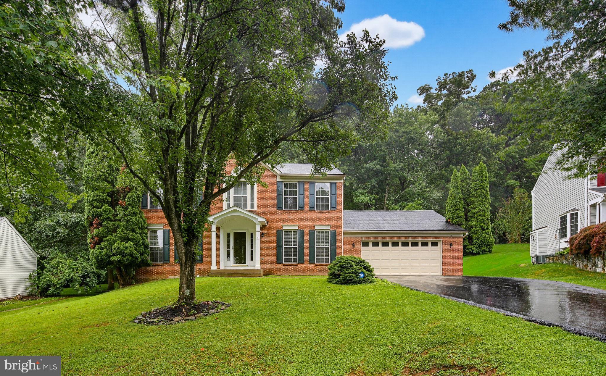 Welcome home to this stunning brick Colonial, perfectly tucked away in the heart of Damascus! Offering 4 spacious bedrooms, 3 full baths, and 1 half bath, this beautifully maintained residence is nestled on a quiet half-mile cul-de-sac and backs directly to the scenic woodlands of Damascus Regional Park, creating a private and peaceful retreat.

Step inside and be greeted by sun-filled living spaces designed for both everyday comfort and memorable gatherings. The elegant formal dining room is the perfect setting for holiday celebrations, dinner parties, and creating lasting memories with family and friends. At the heart of the home, the updated kitchen shines with sparkling granite countertops, sleek stainless steel appliances, a stainless steel range hood, and a center island that invites conversation while cooking and entertaining.

Just beyond the kitchen, enjoy seamless indoor-outdoor living as you step onto the expansive private Trex deck overlooking tranquil wooded views, an ideal space for a summer barbecue or relaxing with your morning coffee. The adjacent family room features a cozy wood-burning fireplace and oversized  window that beautifully frames the picturesque backyard scenery.

The main level is enhanced by gorgeous Virginia Oak hardwood flooring throughout, thoughtfully installed to eliminate squeaks, along with a convenient powder room for guests and a private office/den with French doors, perfect for working from home or quiet study.

Upstairs, the spacious primary suite offers a vaulted ceiling, walk-in closet, and a beautifully updated en-suite bath. Three additional light-filled bedrooms and a renovated full hall bath featuring upgraded tilework and stylish shower detailing completes the upstairs.

The finished lower level provides the ultimate retreat, highlighted by a custom six-person sauna crafted from non-resinous, splinter-resistant wood, an updated full bath, and flexible space for recreation, fitness, movie nights, or relaxing with guests.

Additional features include an oversized attached two-car garage with electric heat and abundant storage, Gutter Guards, chemical-free lawn care, and an ADT security system that conveys with the home—simply activate a new account. Major updates include a new driveway (2023), new carpet (2023), new boiler (2023), and updated bathrooms and tilework.