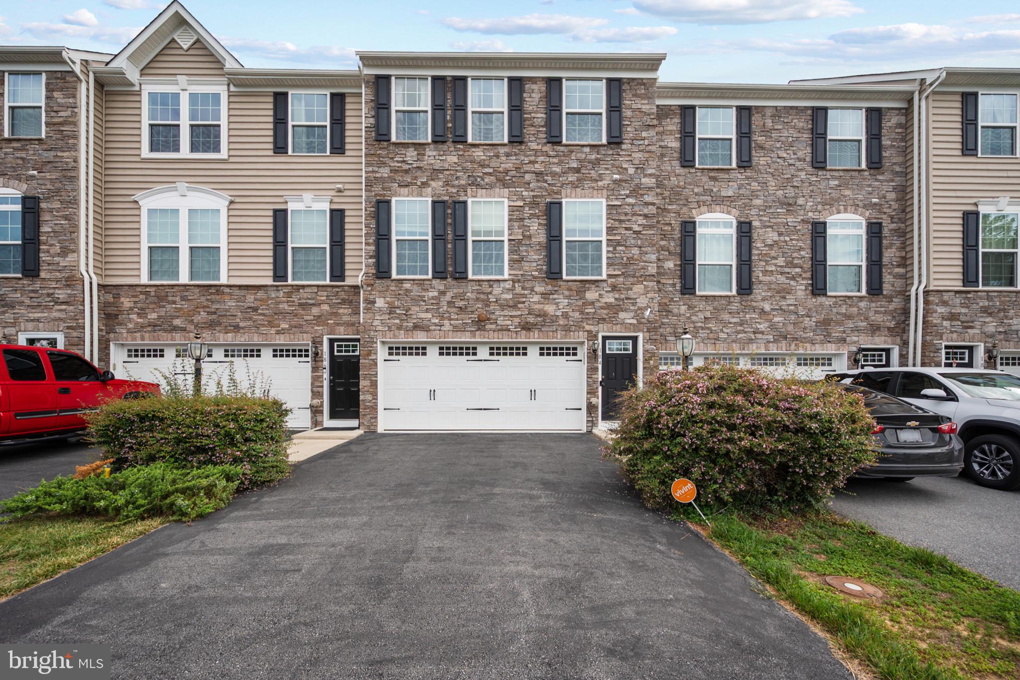 Welcome to this stunning townhome in the highly desirable Lake Frederick community, offering stylish finishes and a spacious, open-concept design throughout.
The main level features durable  LVP flooring and an inviting open floor plan. The gourmet kitchen boasts an oversized island, granite countertops, stainless steel appliances, and rich dark cabinetry that adds warmth and sophistication. Adjacent to the kitchen, the dining area includes additional built-in cabinetry ideal for a beverage bar and provides direct access to the spacious deck overlooking peaceful wooded views.  A convenient powder room completes the main level.
Upstairs, you'll find all-new LVP flooring throughout the bedrooms and new carpet on the stairs. Two generously sized secondary bedrooms share a well-appointed hall bath featuring tile flooring, a tiled shower, and a granite-topped vanity. The expansive primary suite offers a tray ceiling, walk-in closet, and a luxurious en-suite bath with dual vanities, a soaking tub, and a tiled walk-in shower. A large laundry room with additional cabinetry provides added convenience on the upper level.
The finished lower level features new LVP flooring, a full bathroom, and walkout access to a newly installed paver patio with lighting. Relax and unwind while enjoying the private wooded backdrop, creating the perfect outdoor retreat.
This exceptional home combines modern finishes, thoughtful upgrades, and a desirable location, making it a must-see opportunity in Lake Frederick.