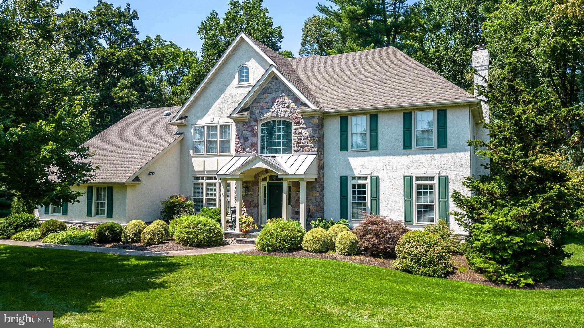 This is an exquisite custom built home perched on a cul-de-sac in Buckingham township, just minutes from the center of Doylestown. Elegant throughout, you will find the property in excellent condition with spacious, yet charming living areas. The central vacuum makes cleaning a more pleasant chore.  The rear yard and professionally landscaped  gardens feature many varieties of plants and flowers, the patio backs up to the Doylestown Borough park which offers tranquility and privacy. Some of its very special features include an ELEVATOR making all three floors accessible to all, newer kitchen with stainless appliances including a large refrigerator with  separate refrigerator drawers ,  large granite counters,  family room with a native stone fireplace, and a  delightful sunroom perfect for year-round viewing of the gardens and wildlife. The home office has built in bookcases and desk overlooking the back yard with custom moldings. The three car garage offers ample parking and storage  space. This beautiful residence has been meticulously maintained and ready to enjoy.