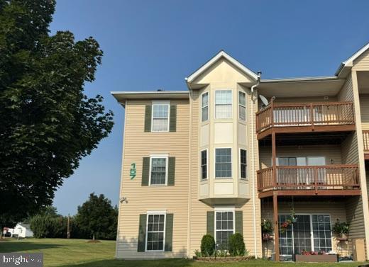 Coming Soon to the Market! 
Fantastic location! This spacious second-floor condo offers more square footage than most units in the community and features an open, light-filled layout, and durable flooring throughout with NO carpet. The thoughtfully designed floor plan includes a large living room, separate dining area, two generously sized bedrooms, and two full bathrooms. The primary suite offers a private bath, a large closet, and plenty of room for a king-sized bed.   
The kitchen was remodeled in recent years with quality cabinets, quartz countertops, undercabinet lighting, and new appliances.  A separate laundry room with a full-size washer and dryer adds everyday convenience. Step outside to the private deck overlooking the common area and mature trees, creating a peaceful outdoor retreat. An additional private storage unit, conveniently located right next to the condo, provides valuable extra space for seasonal items, bicycles, or other belongings.  Condo fee covers common area maintenance, trash, water, sewer and snow removal.  One assigned parking space per unit.