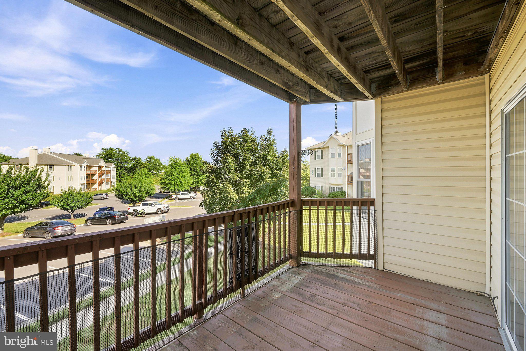 Fantastic location! This spacious second-floor condo offers more square footage than most units in the community and features an open, light-filled layout, and durable flooring throughout with NO carpet. The thoughtfully designed floor plan includes a large living room, separate dining area, two generously sized bedrooms, and two full bathrooms. The primary suite offers a private bath, a large closet, and plenty of room for a king-sized bed.   
The kitchen was remodeled in recent years with quality cabinets, quartz countertops, undercabinet lighting, and new appliances.  A separate laundry room with a full-size washer and dryer adds everyday convenience. Step outside to the private deck overlooking the common area and mature trees, creating a peaceful outdoor retreat. An additional private storage unit, conveniently located right next to the condo, provides valuable extra space for seasonal items, bicycles, or other belongings.  Condo fee covers common area maintenance, trash, water, sewer and snow removal.  One assigned parking space per unit.