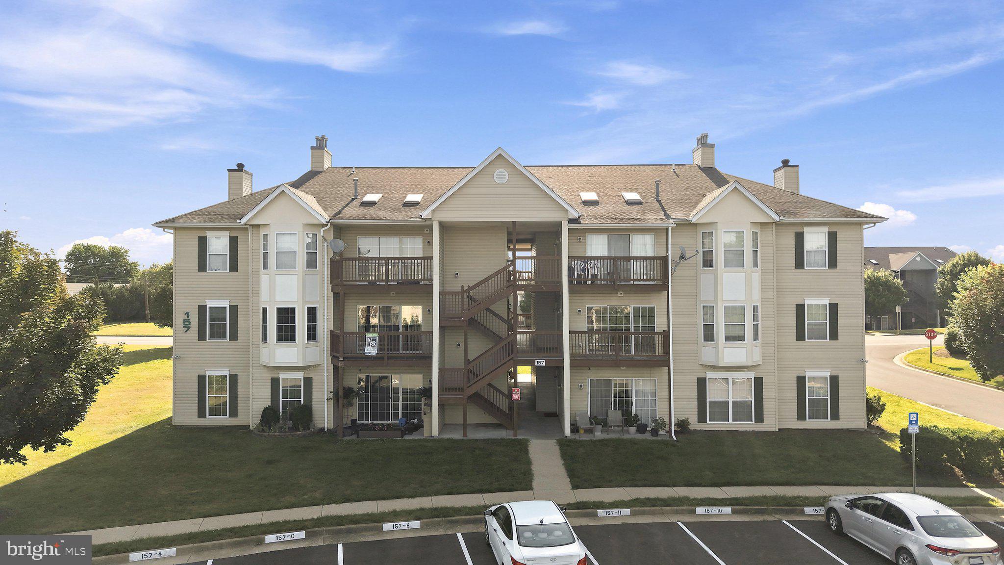 Fantastic location! This spacious second-floor condo offers more square footage than most units in the community and features an open, light-filled layout, and durable flooring throughout with NO carpet. The thoughtfully designed floor plan includes a large living room, separate dining area, two generously sized bedrooms, and two full bathrooms. The primary suite offers a private bath, a large closet, and plenty of room for a king-sized bed.   
The kitchen was remodeled in recent years with quality cabinets, quartz countertops, undercabinet lighting, and new appliances.  A separate laundry room with a full-size washer and dryer adds everyday convenience. Step outside to the private deck overlooking the common area and mature trees, creating a peaceful outdoor retreat. An additional private storage unit, conveniently located right next to the condo, provides valuable extra space for seasonal items, bicycles, or other belongings.  Condo fee covers common area maintenance, trash, water, sewer and snow removal.  One assigned parking space per unit.