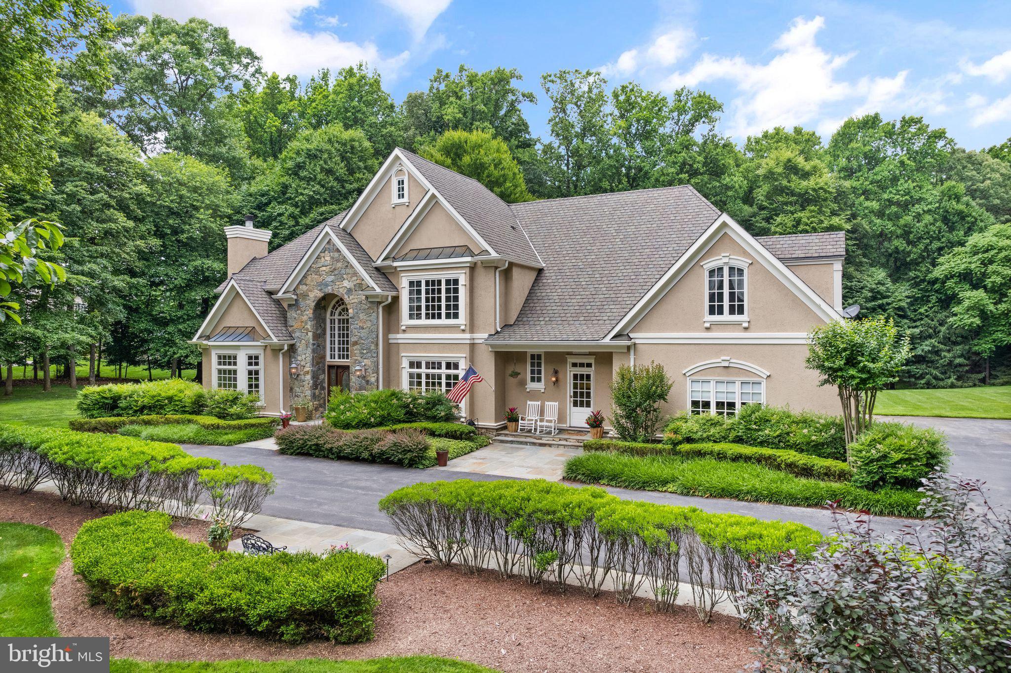 Welcome to this grand, 6 bedroom, 6 .5 bathroom, 7,400+ Potomac home, gracefully situated on a private 2+-acre lot. The first floor is designed for both elegance and functionality, featuring a grand foyer, an elegant living room, and a formal dining room. The open kitchen and family room create a warm and connected space, perfect for daily living and entertaining. A wood-paneled office provides a refined workspace, while a powder room, full bathroom, and mud room offer additional convenience. Completing this level is a three-car garage, providing ample storage and parking. Upstairs, indulge in the expansive private suite, complete with two walk-in closets, wonderful bathroom with large tub and shower, and an attached office or sitting area. Four additional bedrooms, including a guest suite wing, offer plenty of space for family and guests. The large basement enhances the home’s versatility with a bar area, a generous recreation space, a bedroom, a full bathroom, and a bonus room perfect for a gym or office. Outside, the property boasts a 3-car garage and amazing outdoor space with a flat yard and a beautiful flagstone patio, ideal for relaxation and entertaining. To top it all off, the owners will convey plans for a pool, promising even more enjoyment in this stunning home.