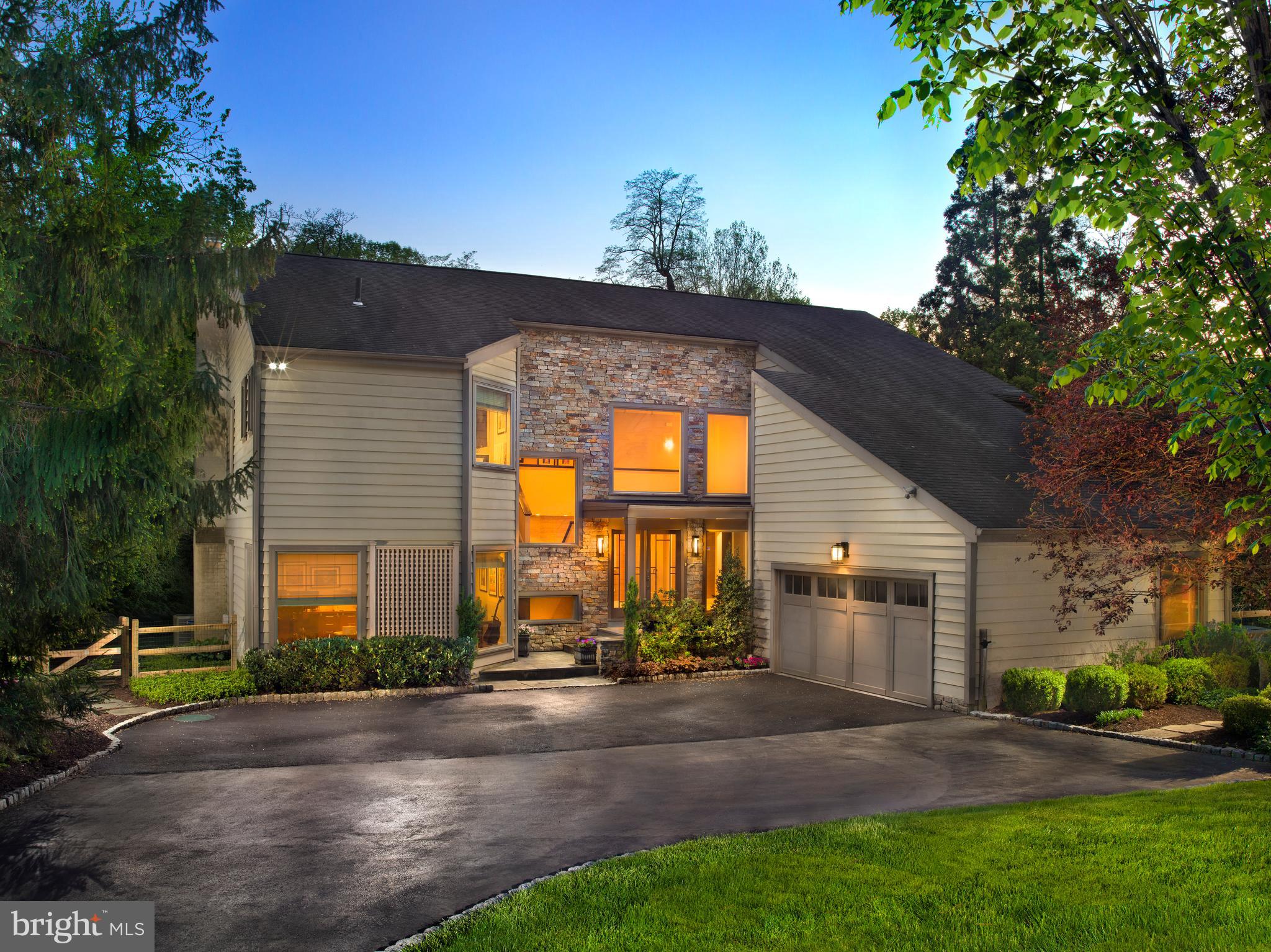Welcome to 1136 Springmont Circle, a beautifully updated contemporary home located in the highly sought-after north side of Bryn Mawr. Tucked away on a peaceful cul-de-sac, this spacious property effortlessly blends comfort and style, set amidst nearly an acre of lush, park-like surroundings.

Upon entering, you'll be greeted by an inviting two-story foyer that sets the tone for the home's elegant yet cozy atmosphere. The standout chef’s kitchen is equipped with high-end Viking  and Sub Zero appliances, a large island, designer cabinetry, and sliders that lead directly to the pool area, making outdoor entertaining a breeze. The kitchen seamlessly connects to a dedicated laundry room, ensuring convenience and practicality.

Next to the kitchen, a charming sitting area with a bar provides the perfect spot for hosting friends and family. Relax in the spacious family room, featuring vaulted ceilings, a stacked stone fireplace, and stunning views of the backyard.

The formal dining room, with its ample size and delightful fireplace, is perfect for gatherings and special occasions. 

The master suite is a true retreat, featuring a luxurious bathroom and an expansive walk-in closet. Step outside to your private oasis, complete with a pool, hot tub, and a stunning IPE wood deck—ideal for both entertaining and unwinding. 

With four spacious bedrooms upstairs and a finished basement offering a fifth bedroom and full bathroom, there's ample space for everyone.  Altogether, the home includes four and a half bathrooms and two convenient powder rooms—one formal and another for poolside use—spread across more than 4,500 square feet.

Meticulously maintained, 1136 Springmont Circle is a gem that beautifully merges modern features with timeless charm. Don't miss the opportunity to make this exceptional home your own!