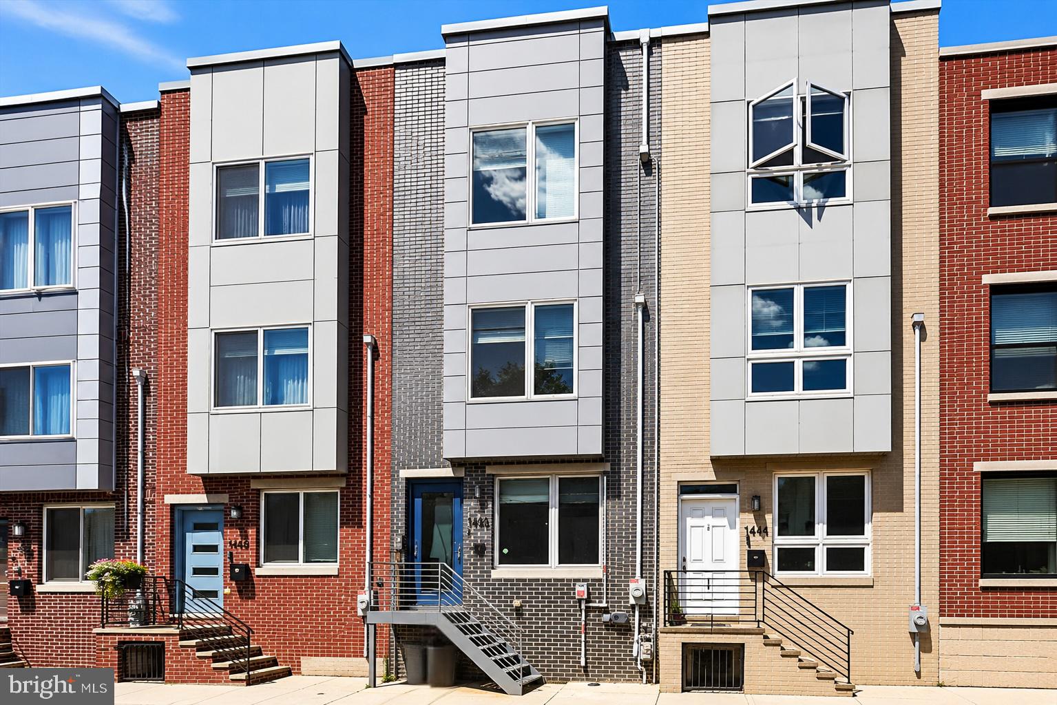 Welcome to 1446 S Taylor St, a stunning home in the heart of Point Breeze! This home boasts 3 bedrooms, 3 bathrooms, and 1,900 square feet of living space--plus a fully finished basement offering a 4th bonus room, perfect for a bedroom, office, playroom, exercise room, or flexible living space. Modern comfort meets thoughtful upgrades in this meticulously maintained home featuring hardwood floors, soaring 9+ ft ceilings, recessed lighting throughout, and hardwired connectivity for seamless streaming, gaming, and work-from-home convenience. Safety and efficiency are top of mind with a water suppression system installed on every floor, a tankless hot water heater (2024), and a fully paid-off rooftop solar panel canopy (2022) delivering exceptional energy savings, with sellers never paying more than $11/month for PECO electric service.  The canopy provides the shade, comfort, and functionality of a traditional rooftop pergola, creating a more enjoyable  roof experience while helping keep utility costs remarkably low. The spacious primary suite offers added comfort with a dedicated mini-split system (2024) for individualized climate control. Additional recent improvements include refinished and waterproofed fiberglass surfaces (2024), three brand-new exterior doors (2024), and a premium $10k Pella patio door (2024) featuring a secure three-bolt locking system and lifetime warranty. The impressive front entry was also upgraded to an Anderson door (2024) with a 7’10” frosted glass door, notably taller than standard builder-grade doors, complete with a transferable lifetime warranty.  Located in the heart of vibrant Point Breeze, this home offers unobstructed skyline views, convenient parking, and easy access to some of the neighborhood’s most popular destinations, including restaurants, coffee shops, bars, grocery stores, parks, and public transportation. Just minutes from Center City, Graduate Hospital, East Passyunk, and University City, the location provides exceptional convenience for commuting, dining, and exploring all that South Philadelphia has to offer. Schedule your showing today and experience city living at its best!