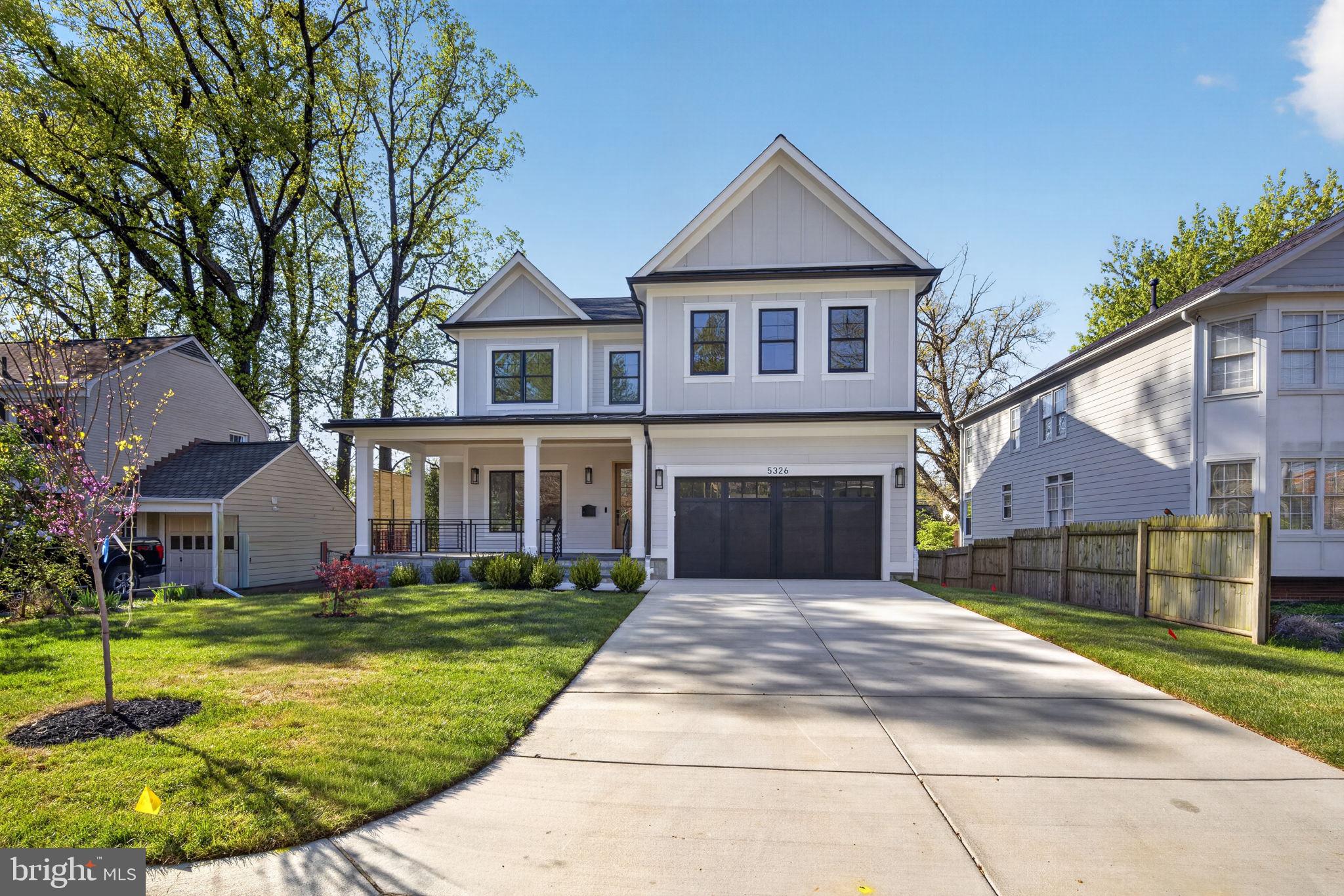 Set on a quiet street in Bethesda, 5326 McKinley Street is a thoughtfully designed new construction home with  showings available now. From the moment you arrive, the home presents a clean, modern take on classic architecture—wide front porch, crisp lines, and a presence that feels both substantial and welcoming. Inside, the layout was designed for how people actually live, with nearly 2,000 square feet on the main level alone .
The main level opens with a proper foyer flanked by a formal living and dining room, creating a natural sense of arrival before transitioning into the heart of the home. The kitchen, breakfast area, and family room flow seamlessly together, anchored by a large island and direct access to the rear deck. A mudroom and attached garage keep things practical without sacrificing design.
Upstairs, the second level offers four well-proportioned bedrooms, including a primary suite that feels tucked away and private. The suite is complemented by a spacious walk-in closet and a well-appointed bath, along with an additional sitting area that adds flexibility for a quiet workspace or retreat . Secondary bedrooms are thoughtfully laid out with access to private baths, and a dedicated laundry room adds convenience where it matters most.
The lower level extends the living space with a large recreation room, wet bar, additional bedroom, and a flexible area that can easily function as a gym, yoga studio, or media room . It’s the kind of space that adapts to whatever stage of life you’re in.
Every detail reflects a focus on longevity, livability, and clean design.
The location is just as compelling. Positioned minutes from the National Institutes of Health, Suburban Hospital, and Walter Reed National Military Medical Center, the home offers exceptional convenience for medical professionals and those seeking proximity to some of the region’s most important institutions. Downtown Bethesda is just moments away, placing you close to some of the area’s best dining, boutique shopping, and everyday conveniences, along with easy access to parks, trails, and major commuter routes.
A rare opportunity to secure a brand-new home in an established Bethesda neighborhood—without the wait.