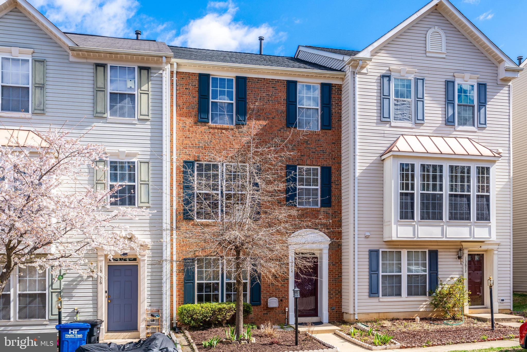 Take a close look at this beautiful brick townhouse—it's in excellent condition!
What makes this home stand out is the spacious layout across three levels and the warmth of real wood floors. Large, well-placed windows fill the home with natural light. The eat-in kitchen flows seamlessly into a sunroom, perfect as a family room or additional living space. The entry-level features a fourth bedroom with a full bath, along with a rec room that opens to a private patio enclosed by a tall fence.  From the kitchen, step onto the wrap-around composite deck, offering a great space for outdoor entertaining.
Upstairs, the primary bedroom comes with vaulted ceilings and a spacious en-suite bathroom with dual sinks, a separate tub, and a shower.
Situated in the heart of the Dulles Technology Corridor—home to industry leaders like AWS, Microsoft, Google, Raytheon, Accenture, Adobe, and Cisco—this location is a smart investment in your future.
