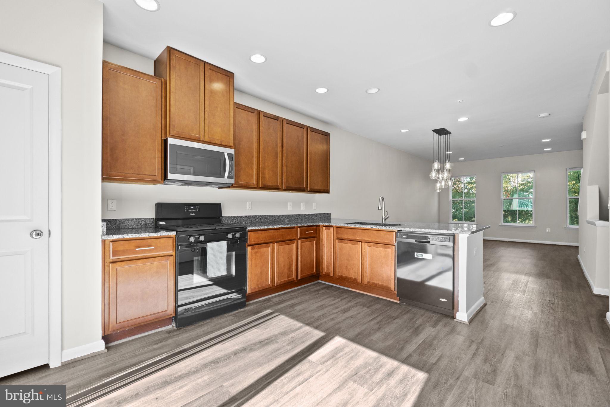 Welcome to your dream home in an unbeatable location! This stunning and move in ready 4-bedroom, 4.5 baths with a one-car garage is a true testament to modern and convenient living. Nestled in a prime location of Downtown Crown, this residence boasts a plethora of features that will make you fall in love at first sight. Step inside to discover an inviting open main floor layout that effortlessly combines the living, dining, and kitchen areas. The flow of natural light creates a warm and welcoming atmosphere, making it perfect for both everyday living and entertaining guests. The kitchen features a granite countertop, gas cooking and pantry. The upper level has two en suite primary bedrooms, each with its own full bath and ample closet space. The washer/dryer are also on this level for additional convenience and practicality. The top level has a huge open area, bedroom with ceiling fan and another well appointed full bath. The rooftop terrace provides panoramic views of the surrounding area. Whether you're enjoying a morning coffee or hosting a soirée under the stars, this space is your private oasis in the comforts of your own home. The community is packed with amenities including a beach entry pool, tennis court, playground set, indoor rock climbing wall, yoga studio, clubhouse and onsite management. Downtown Crown offers tons of dining or shopping option, Harris Teetter, Starbucks, Lululemon, Ted’s as well as green space and parking. Located minutes from I270, Sam Eig Hwy, Rio, Lifetime Fitness Center Gaithersburg, Target and so much more. Open House Sunday 1/21/24 from 12-3pm!