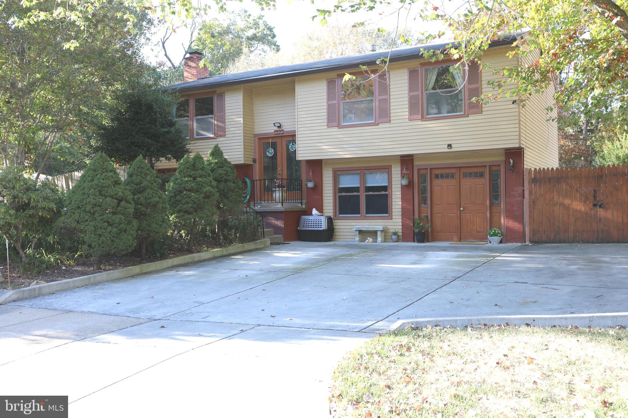 Just Reduced & Refreshed! This home offers space to gather and space to spread out. You'll enjoy the lush, landscaped, and fenced backyard with fruit trees, a large shed, and a covered deck that is ready for you to enjoy. Indoors you'll find an updated kitchen with granite counters and stainless steel appliances. All of the bathrooms have been recently updated as well. The wood-burning fireplace invites you to enjoy one of two family rooms. The other family room is just off the kitchenette area which makes entertaining a breeze. The lower level bedrooms are both en suite with private baths. Close to shopping and easy for commuting. This home is ready for to call your own!