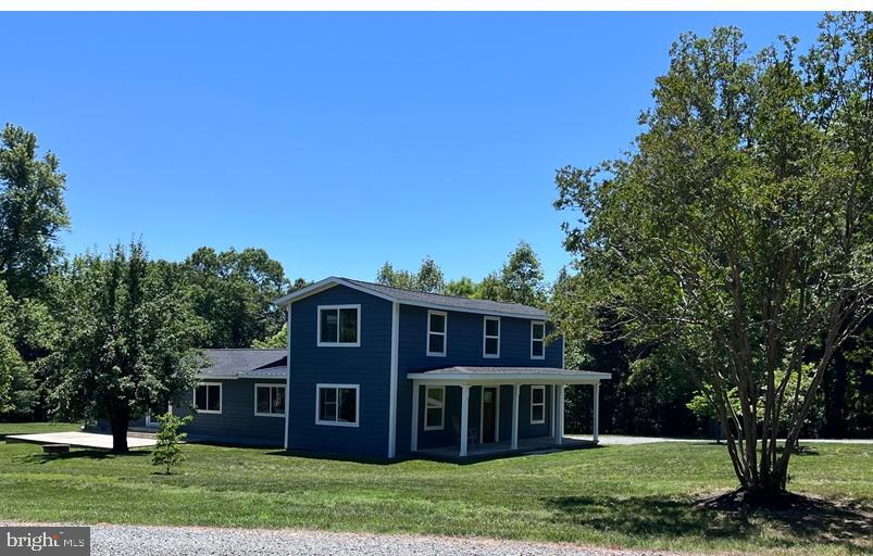 Your dream come true! This newly renovated 1890's 3600 sq. ft. farmhouse sits on 7 private acres and is located within minutes of downtown Mineral. Also included is a recently updated 2 BR brick rancher perfect for use as a stand-alone home for extended family, a guest house, or as rental property to generate additional income. Wooded road-frontage and a gated driveway lead to a clearing where the home is surrounded by mature trees and a beautiful grassy lawn. This home was rebuilt starting at the original foundation and studs and thus presents as a brand-new build with hardwood flooring, two first floor bedrooms with private on suites each with a walk-in shower. A large foyer and living room area leads to an open-concept kitchen-dining-family room with sliding doors and large windows for lots of natural light. The airy kitchen features plenty of cabinets with quartz countertops, a large island, and brand-new stainless-steel appliances. The second floor includes an expansive rec room, large bedroom, full bath, and space great for an office or reading nook. A newly constructed composite deck on one side of the home and a patio on the other ensure easy access to enjoyment of the outdoors. Two hot-water heaters, a whole-house generator, a water filtration system (with an added UV filter), and two brand-new HVAC (3 ton and 1.5 ton) units service the main home. The rancher has been recently updated and features 2 bedrooms, 1 bath, kitchen, family room with fireplace, a utility room, and a new deck, The main home features a whole house generator while the rancher includes a back-feed setup with portable generator. This is a property that truly must be seen to be appreciated as it is a haven for wildlife, boasts mature black cherry trees, pear, peach, apple, and mulberry trees, raised garden beds, a shooting range with protective berm, and a large run-in shed great for equipment storage or perhaps as a shelter for chickens, goats, or even a couple of horses. For someone interested in expanding this property, there is potential for future purchase of an additional 12.4 adjoining acres. This amazing property is conveniently located within 5 minutes of the quaint Towns of Mineral and Louisa and approximately 10 minutes of Lake Anna offering boat launch and on-water and off-water boat storage, Food Lion, convenience shopping, multiple restaurants, putt-putt golf, ice cream, wineries, breweries and Lake Anna Taphouse.
