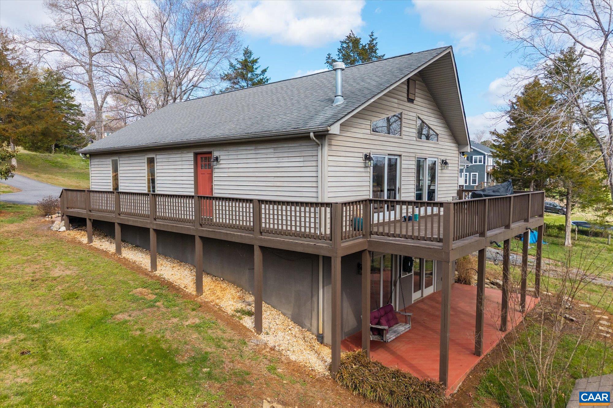 Wake up to sparkling lake views and unwind with peaceful sunsets in this beautifully maintained waterfront retreat. The open-concept main level is filled with natural light, seamlessly connecting the living, dining, and kitchen areas while showcasing scenic views of the water and yard. A striking stone fireplace anchors the living space, creating a warm and inviting setting for everyday living or entertaining. The lower level offers a partially finished space ideal for a recreation room, media area, or guest overflow, along with a convenient half bath. Additional unfinished space provides excellent potential for future expansion, storage, or customization to suit your needs. Located in the Greene Mountain Lake community, residents enjoy access to approximately 60 acres of water for fishing, canoeing, and relaxing at the community beach. Just minutes from local schools and the town of Stanardsville, and with easy access to the Blue Ridge Parkway, this property offers both convenience and a true escape. Perfect as a full-time home or weekend getaway, this lakefront opportunity delivers comfort, flexibility, and a lifestyle centered around nature.,Fireplace in Living Room
