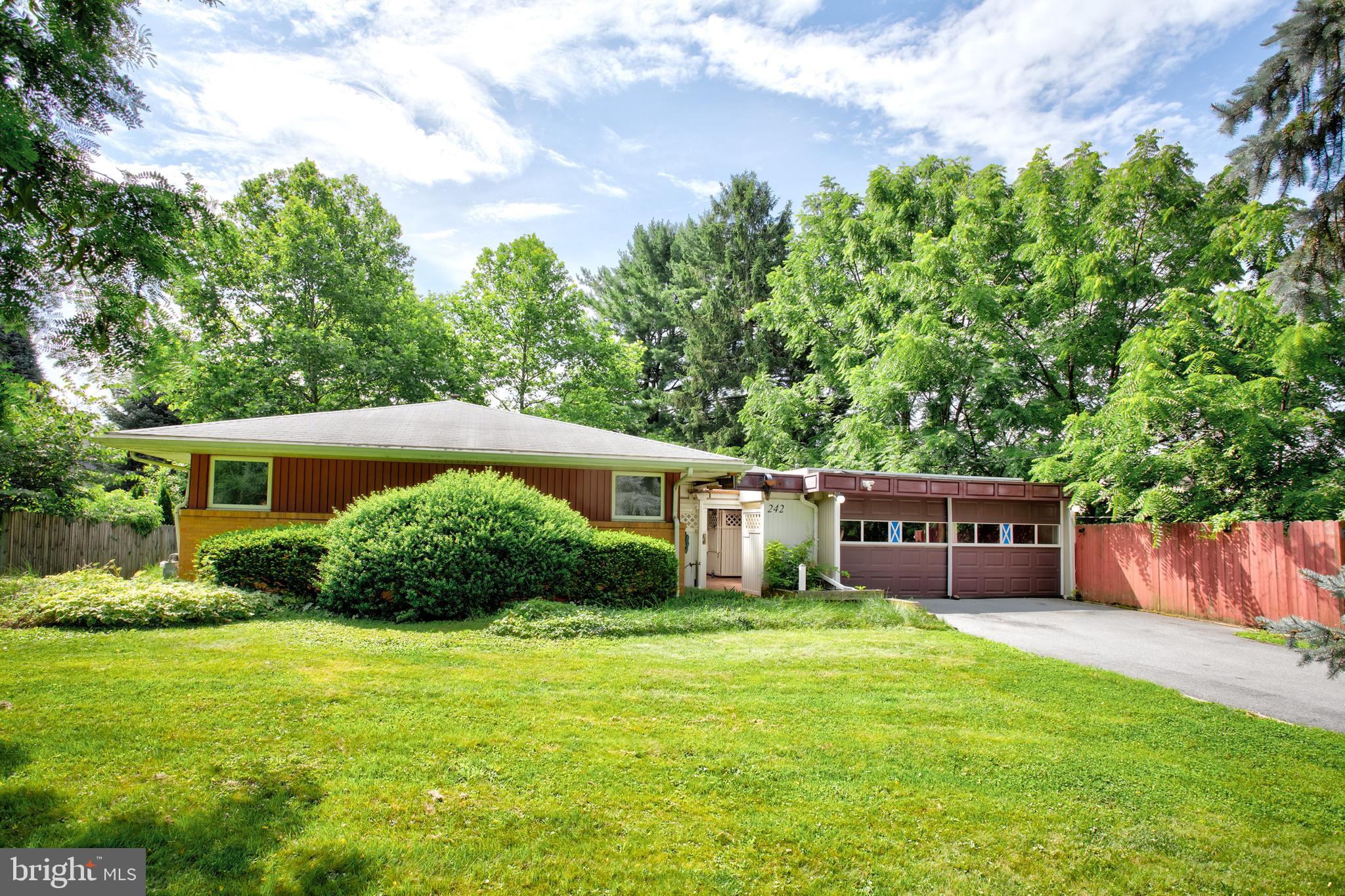 Discover this mid-century modern ranch home in SCASD, just minutes from Penn State University and downtown State College. This distinctive residence offers four spacious bedrooms and three full bathrooms—all conveniently located on the main level for true one-floor living. Some hardwood floors flow throughout the home, enhancing its timeless appeal. The expansive family room features a cozy fireplace and sliding doors that open to the deck and backyard, perfect for entertaining or relaxing. Enjoy the flexibility of two owner’s suites, each with a private full bath - one with a stacked washer/dryer- while two additional well-sized bedrooms share a third full bath, all on the main level.  Nice kitchen, formal dining room, and built-in office desk area round out the main floor.  The partially finished lower level boasts two large recreation rooms, a full bath with a laundry area, and a kitchenette with access to the side yard and ample storage. Additional highlights include a two-car garage, central air conditioning, and more. This property is being sold AS IS and is subject to third-party approval.