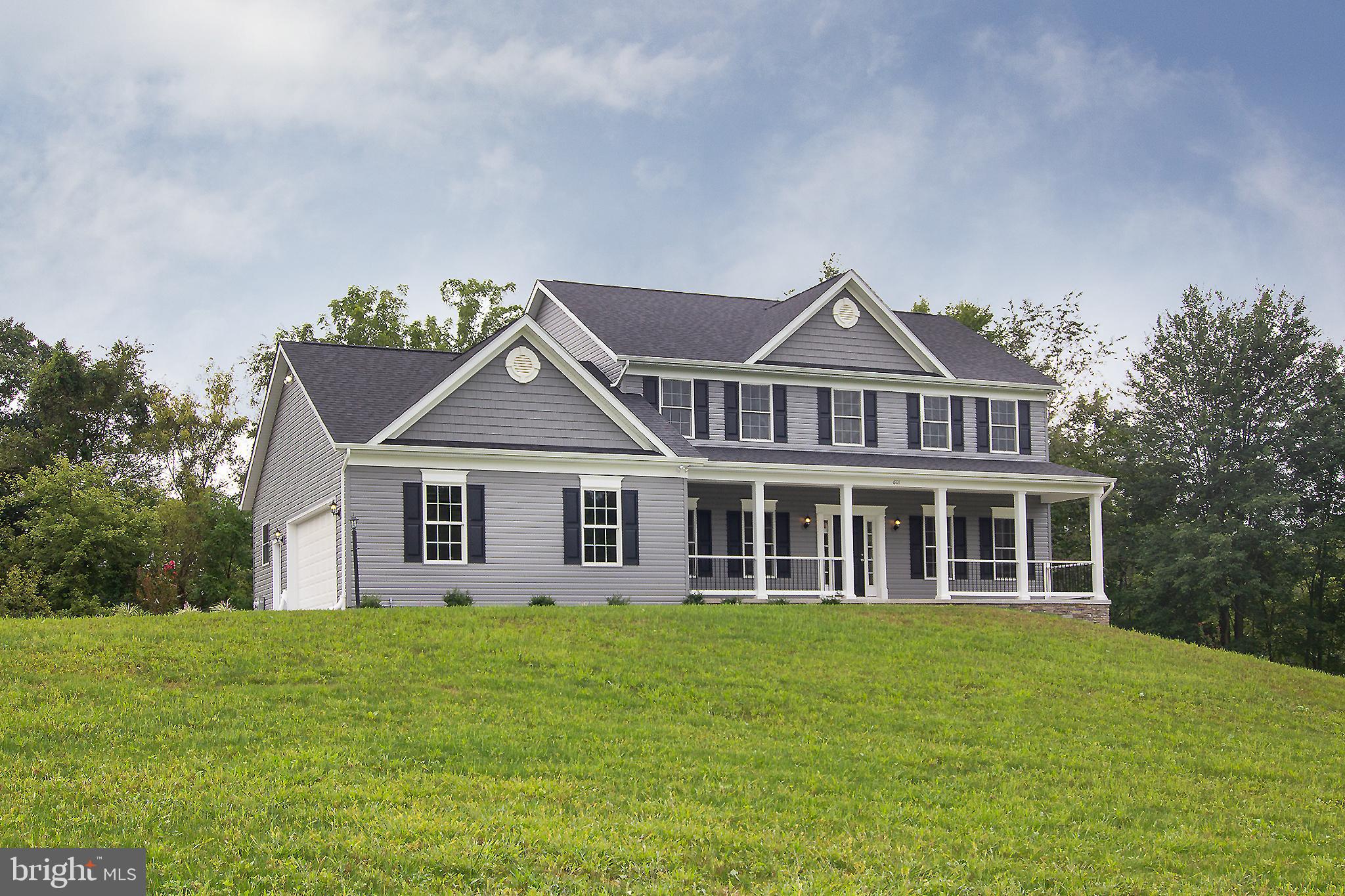 Open House Sundays 12-2  QUICK POSSESSION POSSIBLE !!     New Custom Home on a beautiful 1.39 acre lot.    Large 4 Bedroom 2 1/2 Bath Colonial with a 23X24  2 Car Garage.   The Main Level features a  Formal Living Room or Home Office. Large Dining Room, Family Room, and upgraded kitchen.  Powder Room and 1st floor laundry complete the main level.  Four Large bedrooms and multiple walk in closets on the upper level.  Amenities include Ceiling fans in all bedrooms and the Primary Bedroom has a large Mast Bath with soaking tub.   A Gas Fireplace complements the large Family Room.  Lots of space and lots of storage  in this custom built home.  Still time to choose the carpet for the bedrooms and hall on the upper level.   Wonderful 6 ft front porch and great views!! Taxes are for the lot only   Master Builder #802  Other lots are available.  Buyer pays all doc stamps and transfer tax  Seller will pay $5,000. toward buyers closing with restrictions.   Other lots available