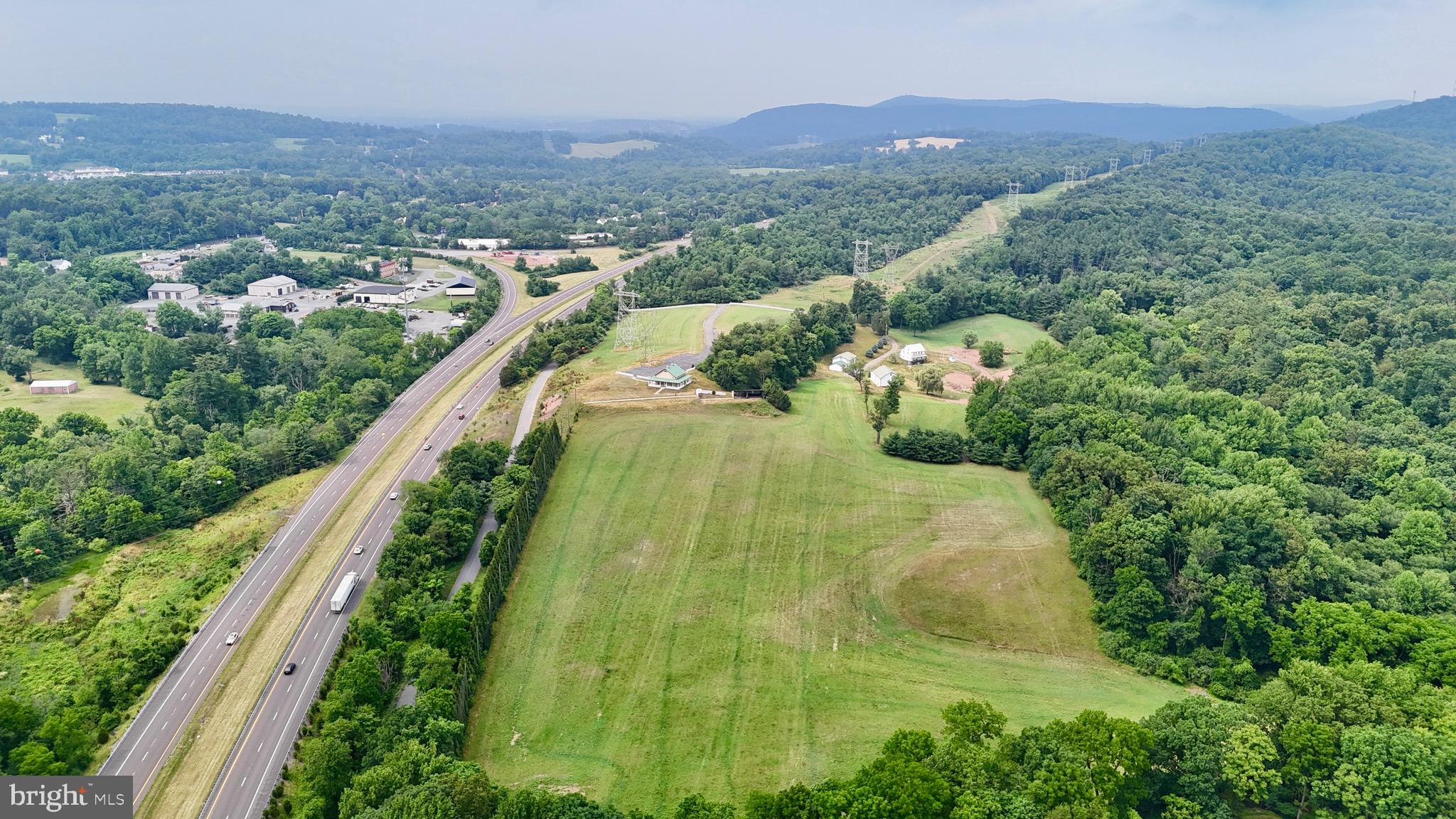 An exceptional opportunity to acquire nearly 48 acres of land zoned General Commercial, strategically positioned along Interstate 176 in rapidly growing southern Berks County. With outstanding visibility, immediate highway access, and a wide range of permitted commercial and business uses, this property offers scale and flexibility rarely found in southeastern Pennsylvania.

A recent engineering concept demonstrates the ability to create an approximately 12-acre contiguous building pad through conventional grading, making the site well suited for a variety of commercial and industrial development opportunities. Whether your vision includes distribution, flex industrial, business park, self-storage, hospitality, recreation, or a corporate campus, this property provides a strong foundation for large-scale development.
A portion of the property is in the process of being permitted as a fill site, with conceptual plans showing over 500,000 cubic yards of capacity.
The property's General Commercial zoning permits an unusually broad range of uses, including Business Parks and Industrial Parks, while its location immediately adjacent to I-176 provides convenient access to Reading, Lancaster, the Pennsylvania Turnpike, Route 422, Philadelphia, and the broader Mid-Atlantic region.
For buyers seeking long-term strategic value, the property's proximity to major electric transmission infrastructure may present additional future opportunities, subject to utility studies and governmental approvals. A conceptual study from First Energy shows 100 MW available with minimal upgrades, and 150 MW also being achievable. A large supply of natural gas is also available, although at significant cost to bring to the site.
Development sites of this size, location, and zoning are increasingly difficult to find. Whether you're an owner-user, investor, or developer, this offers a unique opportunity to create a signature commercial project in one of Berks County's most accessible locations.