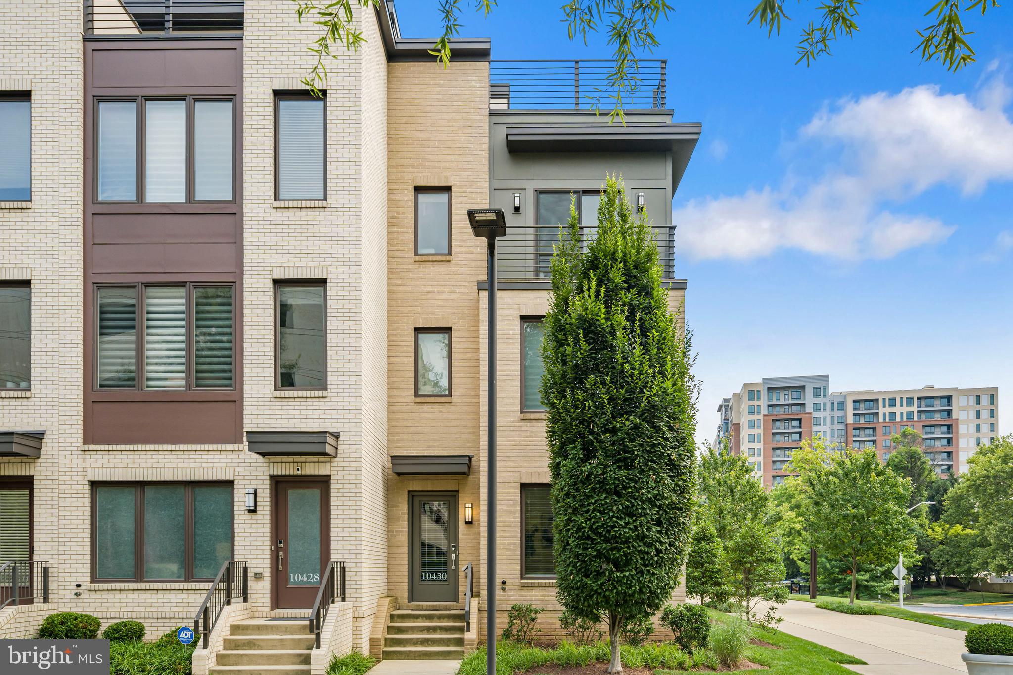 Built in 2019 and freshly painted throughout, this beautifully maintained end-unit townhome is perfectly situated on a premium corner lot, offering extra privacy, beautiful views, and abundant natural light from oversized windows on every level. With 9' ceilings, hardwood floors throughout the main living areas, and designer finishes, this move-in-ready home combines modern style with everyday comfort.

The open-concept main level is ideal for both entertaining and daily living, featuring a gourmet kitchen, spacious living and dining areas, and seamless flow throughout the home. The additional windows unique to the end-unit location create bright, airy spaces filled with natural sunlight.

The top level offers incredible flexibility with a spacious loft, a private fourth bedroom with an en-suite bath, and access to a rooftop terrace with a gas hookup, perfect for grilling, outdoor dining, entertaining guests, or relaxing under the stars. Whether used as a guest suite, home office, gym, or media room, this space easily adapts to your lifestyle.

The HOA fee  includes complimentary EV charging, one street parking permit, one garage parking permit, and garage access. The property also comes with two dedicated parking spaces, with additional overnight street parking available through homeowner-issued permits.

Conveniently located near Cabin John Park, top-rated daycares, grocery stores, cafés, Montgomery Mall, and major commuter routes, the community also offers direct bus service to Grosvenor Metro and downtown Bethesda. Situated within the highly sought-after Walter Johnson school cluster, this exceptional home offers the perfect combination of space, convenience, and one of Bethesda's most desirable locations.