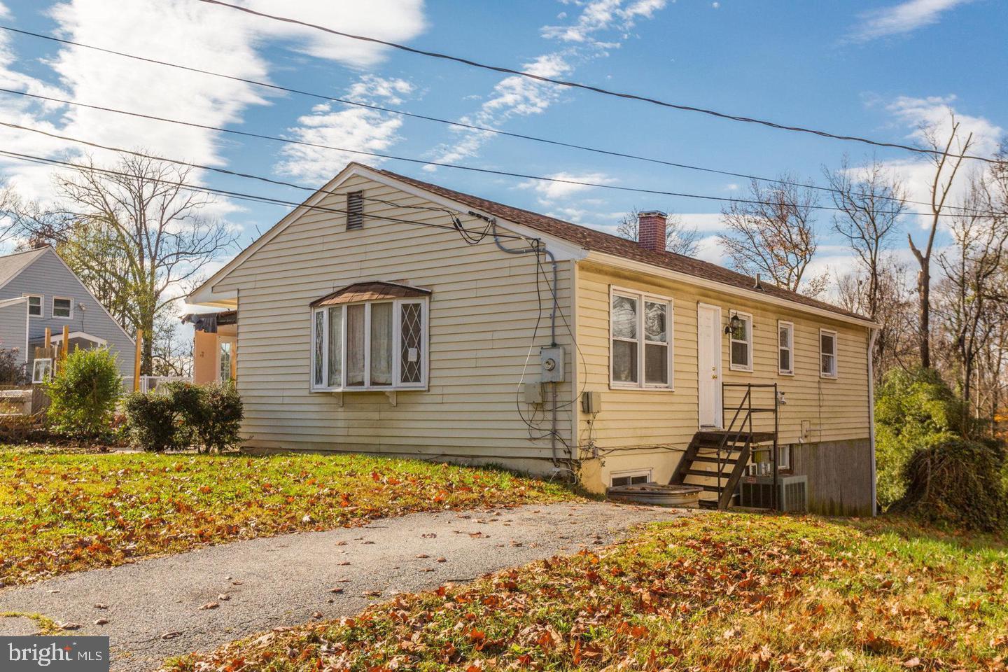 Bring your vision and unlock the potential of this spacious 5-bedroom, 2-bathroom single family home, approximately 2,300 finished square feet.  Yes, it needs some updates — but the bones, the space, and the location make every bit of that work worth it.
The main level welcomes you with gleaming hardwood floors and a beautiful bay window that fills the space with natural light. You'll find generously sized bedrooms throughout, plus a rear addition accessible from two of them — perfect for a home office, sitting room, or creative retreat.
The real showstopper? A fully self-contained lower level that lives like a private suite: two large bedrooms, a full bathroom, a comfortable living area, a full kitchen, and its own separate exterior entrance. Ideal for multi-generational living, extended guests, or income potential (buyers to verify permitted use).
Location delivers on every front. Shopping is just minutes away, and commuters will appreciate quick access to I-495, the BWI Parkway, and Metro. You're also close to the University of Maryland and NASA Goddard — a rare mix of convenience and long-term value.
Homes with this much space, flexibility, and location upside don't come along often. Come see the potential for yourself.