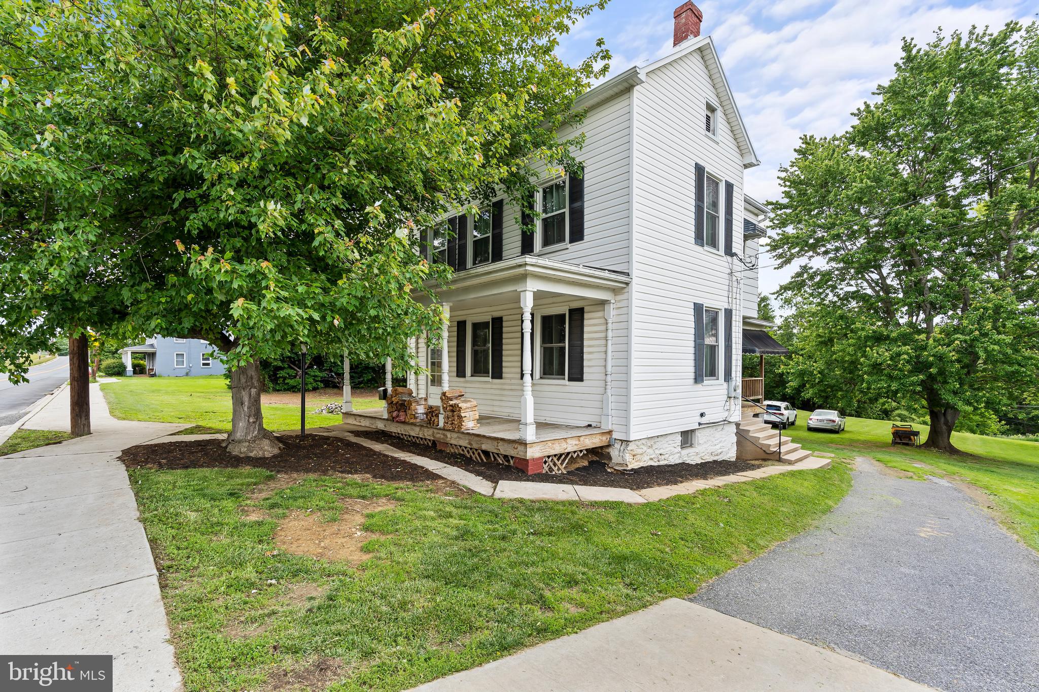 Professional photos coming Saturday!

Welcome home to 5 Main Street in the sweet town of Myersville!  A commuters dream, this location provides both easy access to I70 with the allure of of small town living.  The home  sits on just shy of 3/4 acre lot with mountain views in all directions.  Enjoy the views from the front or side porches, or perhaps from the patio out back.  Come inside and see the large room sizes with hard wood floors through out.  The first floor spaces include a large - recently redone- country kitchen with space for a dining table.  The front of the home features the ample living room, as well as a secondary space that is perfect for a playroom, den or hobby space.  The upper level of the home features 3 bedrooms with ample closets, and the bathroom with new flooring and vanity .  Finish the bathroom to your taste.  Storage is not a problem given the attic space and basement.  In addition to storage, the basement also houses a dedicated laundry space with washer/dryer, AND is walk out level to that private back yard! 
New HVAC was added to ensure the upper level stays nice and cool on warm summer evenings.  Newer energy efficient windows and doors.    Middletown Schools!